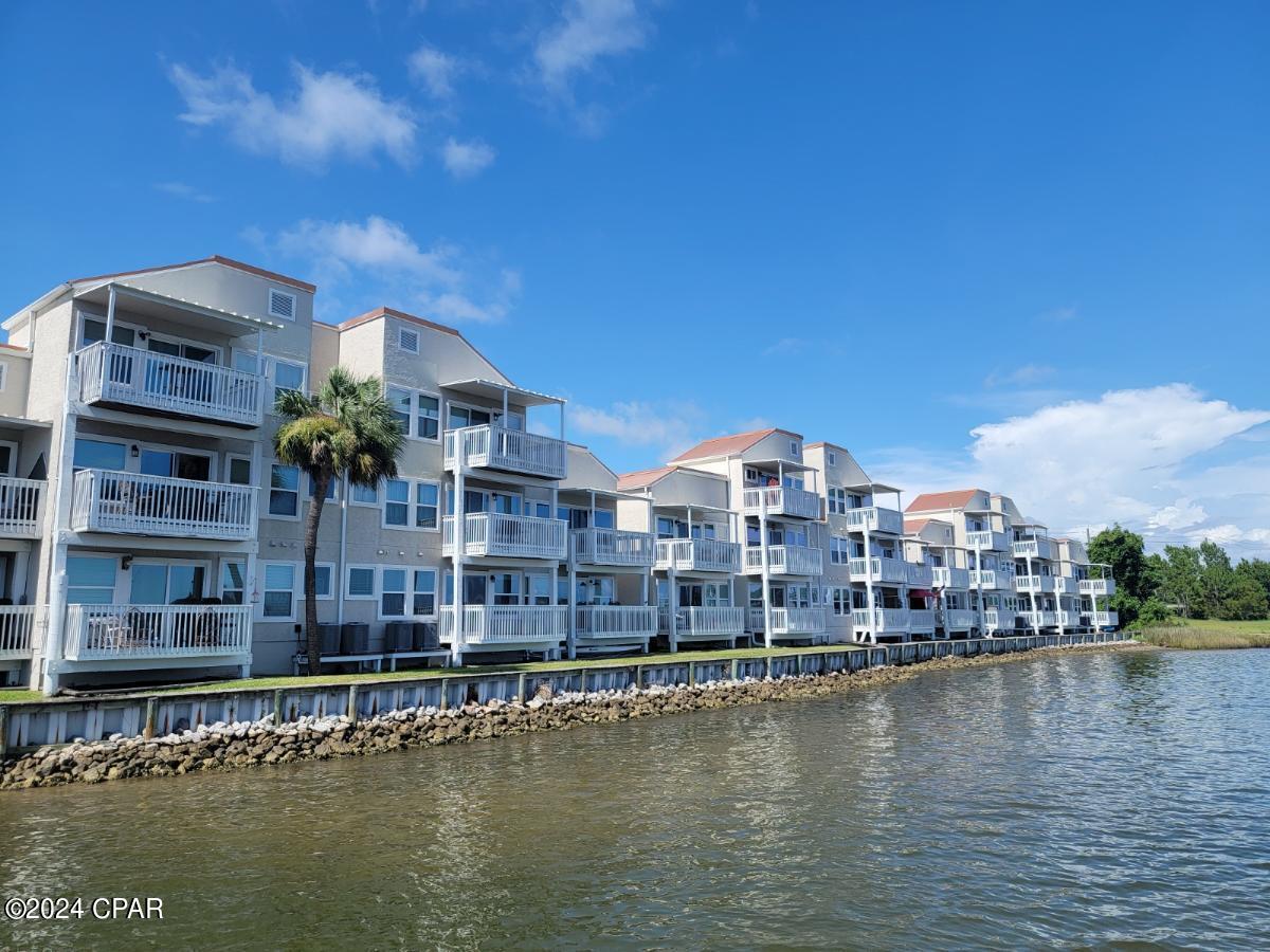 Welcome to Bayou Pointe Villas which sits on beautiful Watson Bayou. This a 1 bedroom, 1 bath furnished waterfront condo with a spectacular view.  This condo is located on the 2nd floor and has been nicely updated. The kitchen features Stainless steel appliances, including dishwasher, stove, refrigerator, and microwave. Breakfast bar with granite countertops.  Washer and dryer are also included.  This community is private and gated.  The rent includes water, sewer, garbage, and internet. This location is convenient to downtown Panama City shopping & restaurants. As well as historic St. Andrews, Ascension Sacred Heart Hospital, Tyndall AFB, beaches, and much more! A boat slip is also available and can be rent separately for $350.00 per month. Application required. No Pets. Call to schedule tour!
