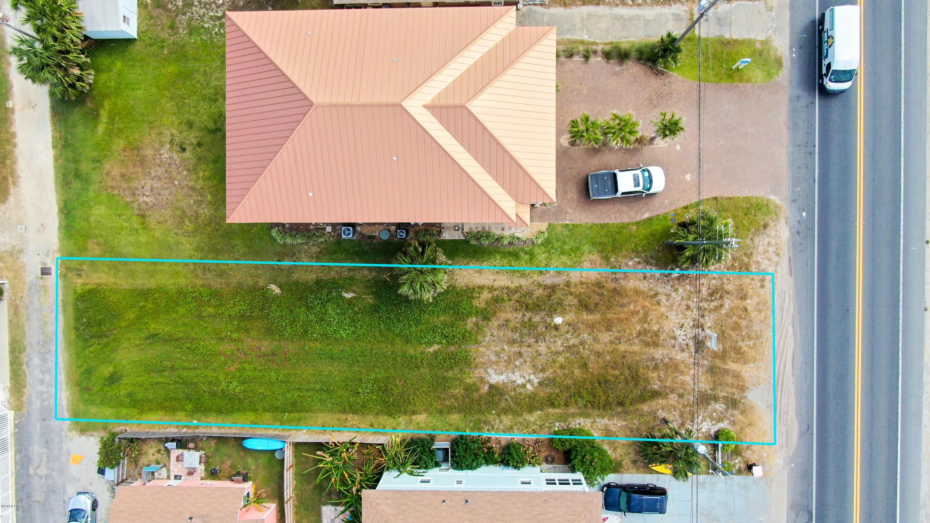 Sunnyside beach vacant lot across from dedicated beach. Being a dedicated beach, no building or development can be built on the beach side of road!