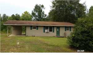 Charming brick home in the country located on over an acre of land! This brick home has a carport with a laundry room and storage unit. The large kitchen has plenty of cabinet space and is open to the dining area. Laminate floors throughout the house, tile in the kitchen and bathrooms.