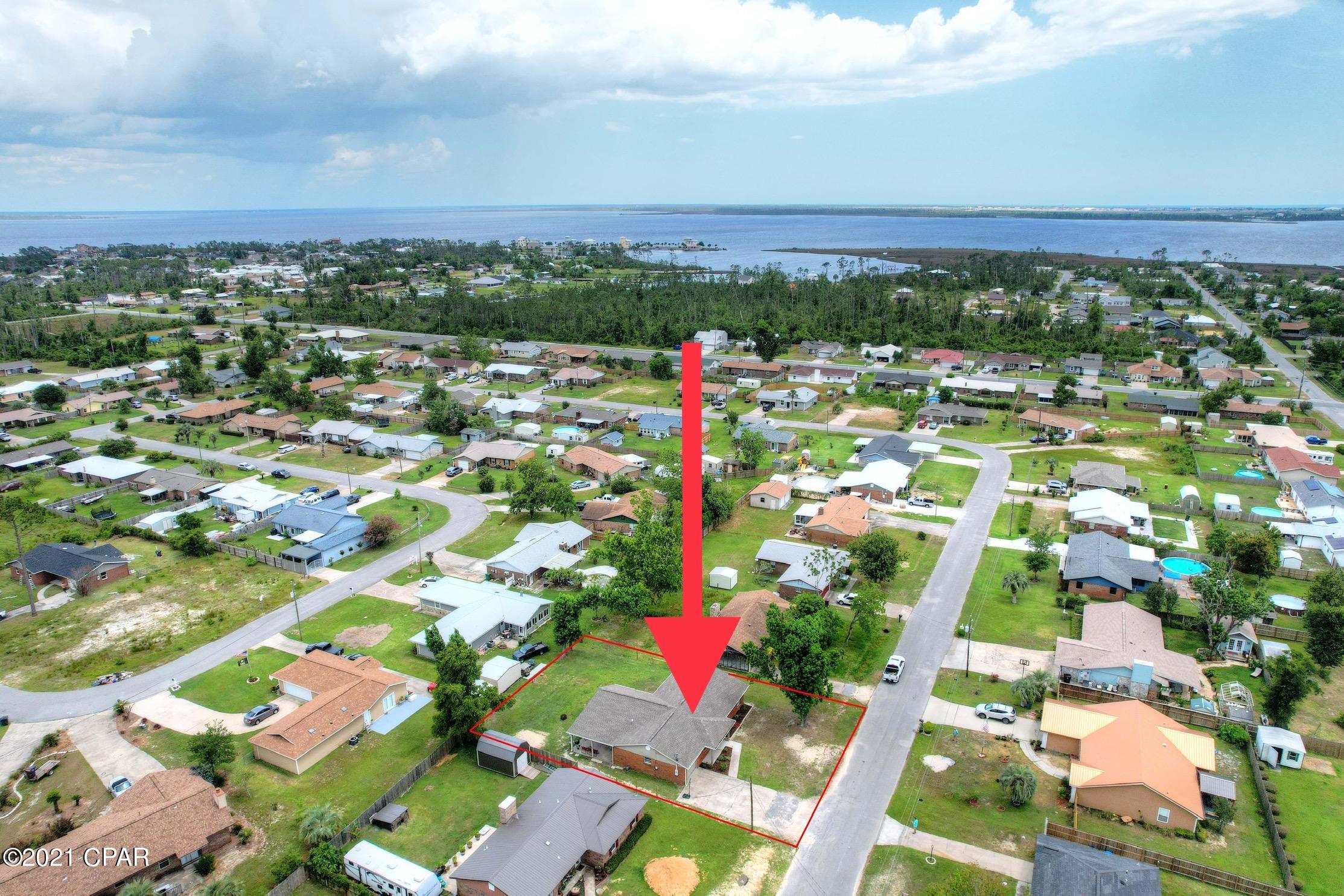 CURRENTLY UNDER CONTRACT, SELLER ACCEPTING BACKUP OFFER. This is a great family home! Recently updated and move in ready! This home has been well maintained and has enough room to park a boat or RV. Other exterior features include a new roof (2019) and brick exterior. Inside you will see tile throughout the home and new carpet in the bedrooms (2020), new paint (2020) as well as new stainless steel appliances (2020). The ceilings are vaulted with beams in the kitchen which also features an island. There are 2 living areas! This home is located in a quiet neighborhood near East Bay. In less than 2 miles you will be able to get to Tyndall AFB, Under the Oaks park or the public boat ramp near the Tyndall Bridge.
