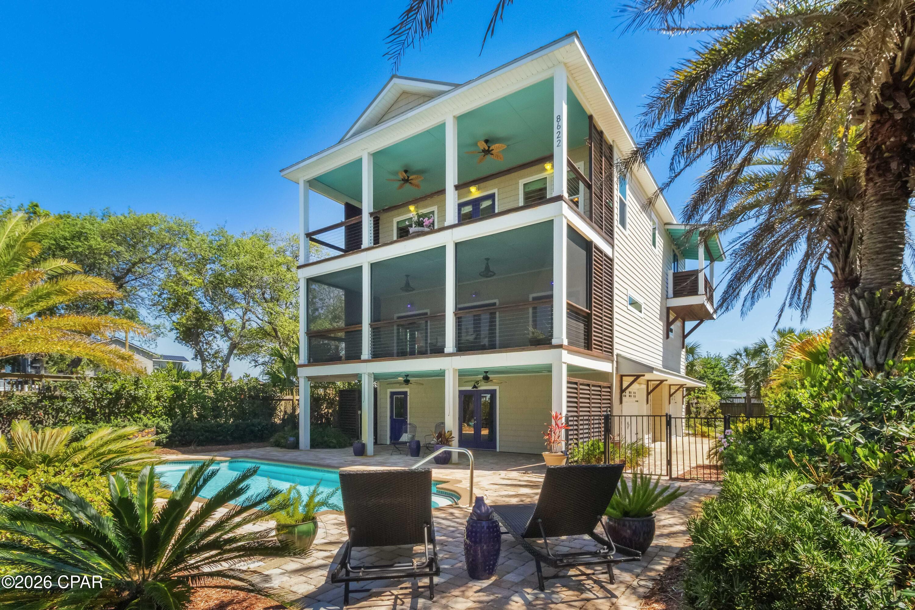 Check out this rare opportunity to own a hilltop custom home with exceptional Gulf views on Florida's Forgotten Coast.  This custom-built home has never been used as a rental and has had just one owner who meticulously maintained it. It has the charm and details perfect for a personal residence, but also massive rental possibilities for investors. 


This three-story coastal home sits on an expansive .573-acre parcel in St. Joe Beach just east of Mexico Beach and directly across from the Gulf.  This property offers unbelievably large front and backyard spaces for a home that is so close to the Gulf.  The backyard alone is approximately 100 feet by 60 feet, which is larger than many nearby lots.  As a result, this home has nearly endless exterior parking opportunities whether it be for your boat, RV, or extra spaces for renters.  All of this space also provides the flexibility to add additional square footage, especially when you consider that this property is not in a flood zone.


The outdoor living space is where this home truly shines. The inground pool is framed by an elegant brick paver deck, creating a polished, resort-like setting. Surrounded by mature, thoughtfully designed landscaping, the pool feels tucked away and serene--something increasingly hard to find at the beach. The private outdoor shower adds a distinctly tropical touch, while the nearby tiled bathroom offers convenience for pool guests.


From the ground level, access all floors by elevator or by an upscale traditional staircase - no need to struggle with exterior stairs or a narrow staircase common in many beach houses.  Also, the elevator offers handicap accessibility that is rare in multi-story coastal homes. The home has hurricane impact windows throughout. The third floor is the heart of the home--an open-concept living, kitchen, and dining area designed to capture elevated views of the Gulf. A gas log fireplace anchors the living space, while the 30x12 foot front porch invites you to relax and take in the coastal breeze. Two additional bedrooms share a full bath, and one features its own private balcony overlooking the water. An oversized walk-in pantry that could also be used as a lock-out closet completes the thoughtfully designed upper level.


The second floor is designed with comfort and flexibility in mind. The spacious master suite and bonus area occupy the entire front of the home -- featuring dual vanities, a large tiled shower, and a walk-in closet with a custom shelf system. The master suite's generous 14.5 x 11 foot bonus room is perfect for an office, gym, nursery, additional sleeping space, or just a luxuriously large seating area. Both the bedroom and bonus room open to a full-length screened porch with gas and water hookups, creating a peaceful, year-round retreat with Gulf views. A private guest suite with en suite bath sits toward the rear of the home.  Between these two suites sits a custom, built-in laundry area with surrounding cabinetry and workspace, which blends in seamlessly and allows you the option to conceal the washer and dryer. 


The center of the ground level features a formal foyer and seating area leading to the elevator and staircase. On each side of the foyer is an extra large enclosed garage bay each with additional storage closet space.  The right garage bay is expanded to accommodate a golf cart or riding mower and is complete with its own automatic rear-entry garage door, while the left garage bay features direct access to the pool.  Outside just steps from the pool is a quaint pool house with a bright, cheerful interior.  It includes electricity, a ceiling fan, refrigerator, counterspace and a large sink. Whether used as a poolside lounge, creative workspace, or additional storage, it enhances the entire outdoor experience. Altogether, this setup creates an ideal environment for hosting--seamlessly accommodating long beach days, pool gatherings, and effortless indoor-outdoor living. Situated next to Veterans Memorial Park at Beacon Hill, you will enjoy a large beach access, four pickleball courts, a dog park, playground, and more.  Unique Forgotten Coast experiences like scalloping and fishing in St. Joe Bay and evenings in historic downtown Port St. Joe, resort-style downtown Windmark Beach, or charming Mexico Beach are just minutes away.


Never rented and lovingly cared for, this home offers exceptional income-producing potential with no HOA fees or restrictions and low unincorporated property taxes.  With space, charming details, accessibility, and a resort-style outdoor setting just steps from the Gulf, this is a property that truly stands apart.  To see more, please request the virtual tour!