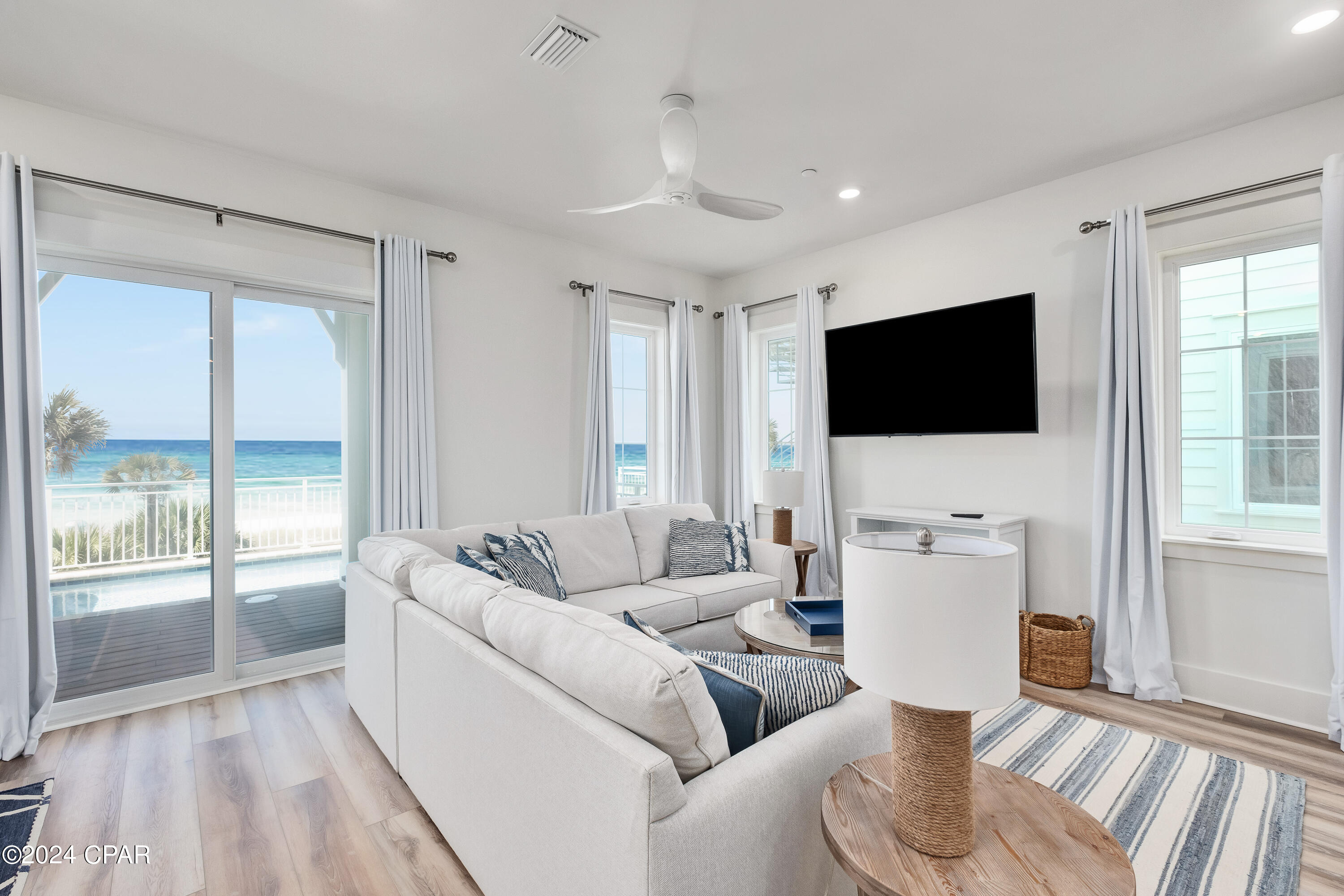 BACK ON MARKET, SELLER SAID TO MOVE IT! BRING OFFERS! THIS 6 BEDROOM 6.5 BATH GULF FRONT WITH PRIVATE POOL IS READY FOR THE SUMMER! Enjoy your time at PCB's Margaritaville Resort in one of the Best Gulf Front Luxury Beach House in the Resort.  Unit 3 has the Best Gulf Views and as well easy access from Front Beach Road but that's not all, this unit was customized by the owners with a different furniture package and decor to make it special. In addition, the home has never been rented but can be put on the Margaritaville rental program immediately if so desired. The Oasis Floor Plan features offer 3990 SF of living space with an endless view from the balconies on each floor with Two Master suites on the Third Floor.  The First Floor offers a Recreation Room with Mini-Kitchen, and a with a gaming area with foosball table, Bunk Room and an Elevator as well as entry to the oversize deck featuring a Private Pool, oversize deck with Grill & a Private Beach walkover with outside shower.  The second floor features the living area with an open Great Room that opens to an oversize balcony with endless views East and West, Two Bedrooms with Ensuite Baths and a large laundry with additional storage.  The Third Floor offers three bedrooms, all with ensuite baths, with two being master bedrooms on the Gulf side with endless views of the coastline of PCB. All this with the amenities of Margaritaville PCB Resort including, The Salty Rim Bar & Grill, Fins Restaurant and Bar, (opens in 2024), and a 425-foot lazy rive Lagoon Pool that is Margaritaville's signature at each of their Resorts.  Get ready for good times as it's 5 o'clock somewhere at Margaritaville Resort. Food and Beverage bar area is now open at Pool side in the resort, come join the fun as Margaritaville Cottage Resort takes shape.