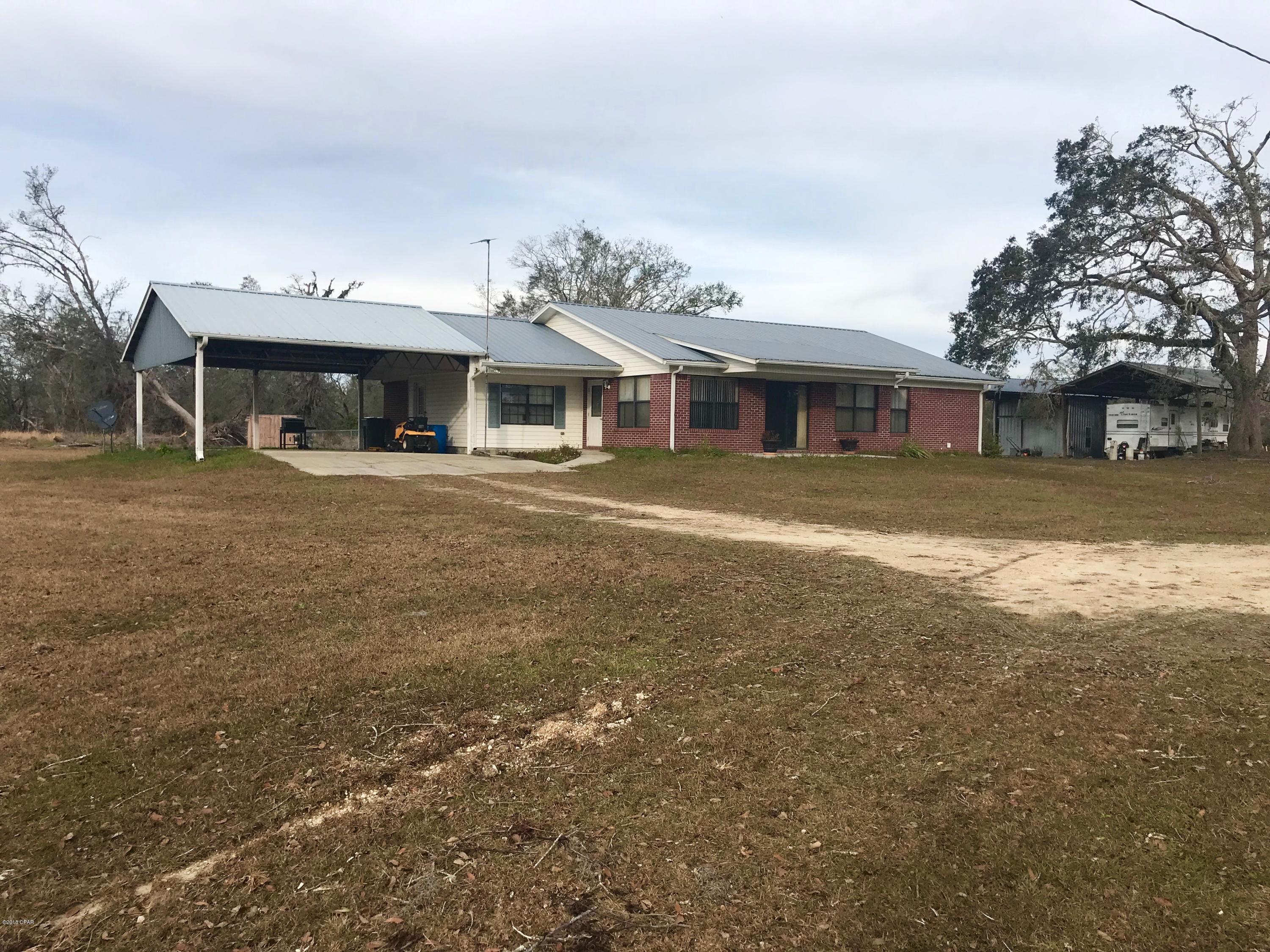 19.69  ACRES, Pasture, 4 AWESOME FISH PONDS! Well maintained and updated brick home. 2020 heated sq ft, 3br/2b's, Double Pane windows, C/E heat n cool, laminate wood flooring, nice large kitchen with eat in area, bonus room with built in cabinets, large Family room with gas fireplace unit, large screen porch and fenced back yard for pet. Pole barn, shop with concrete floor and electricity. Great for horses and great fishing.