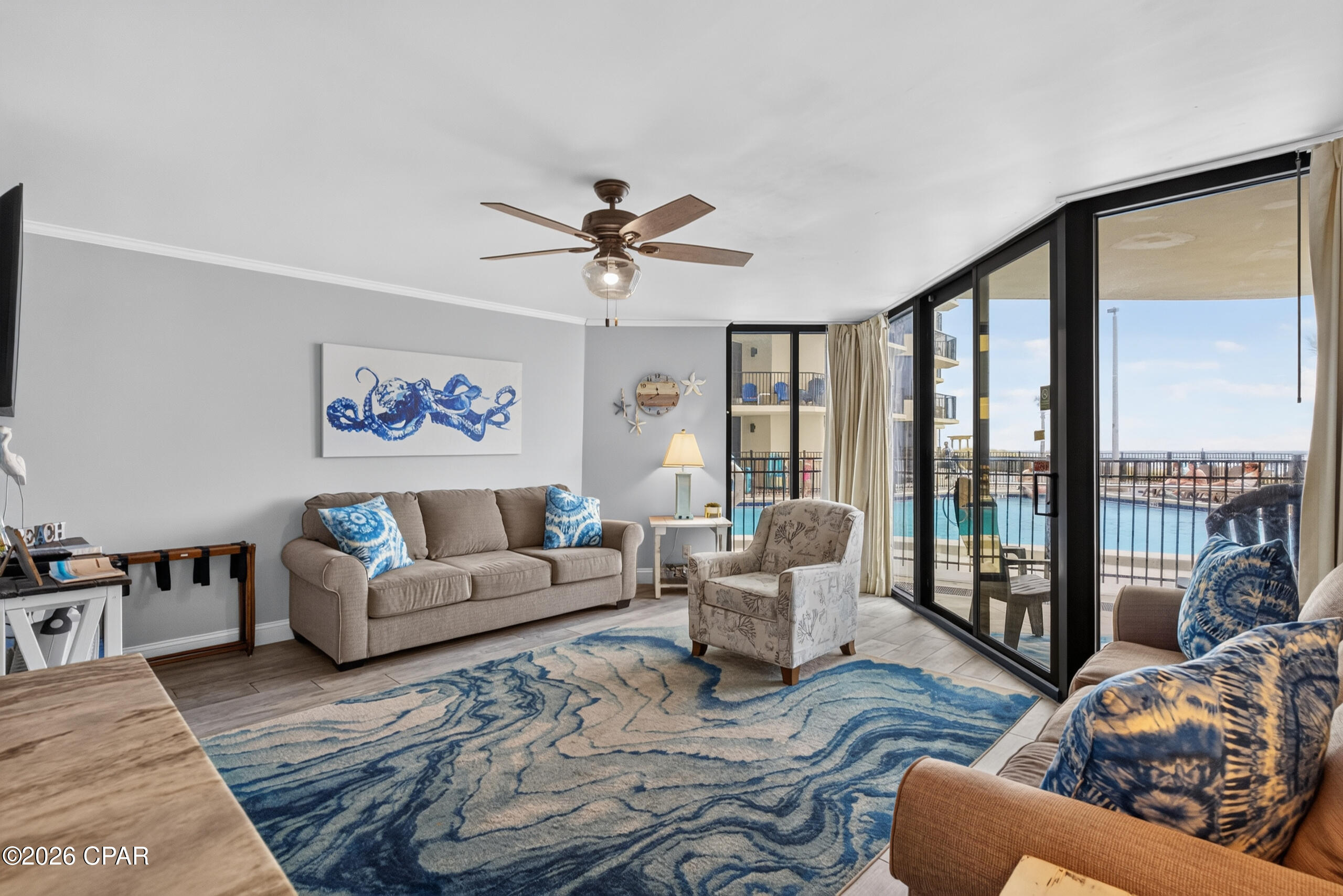 NO ELEVATOR WAITING WITH THIS FULLY RENOVATED, UPDATED AND UPSCALE BEACHFRONT CONDO RIGHT NEXT TO THE GRAND POOL AT SUNBIRD! Amazingly UPSCALE condo features granite countertops, white cabinets, gold accents and a beautifully and tastefully beach themed furnishied interior. 
For those who are a little wary of high floors this is the perfect destination. Walk straight in from your car, no waiting. Walk right out to the pool that you can view from your window, or hit the beach just steps away! Go grab some lunch and a world famous beverage at PINEAPPLE WILLY'S thru the gate from Sunbird to their property. Extra bathrooms, snack machines and ice machine all right there next to your unit, covered with a shaded outdoor seating area for you and your guests to enjoy!This unit is directly next to the LARGE CENTER POOL at Sunbird, and there are three pools to enjoy! Walk to Waffle House, Walmart, an arcade with bowling alley, golf games and more. Take a ride to Captain Anderson's for an elegant meal on the waterfront at this historic restaurant just 9 minutes away! There is so much to do and see from this location, you will ablsolutely LOVE IT. Fitness center, tennis courts, pickle ball, shuffleboard, and a fully renovated complex with no SPECIAL ASSESSMENTS is waiting for you to come enjoy, all secured with 24 hour gated security attendants and guest screening. You can manage your own property here or have one of the very successful rental companies manage your property for you year round. Call today and LET'S GET STARTED ON YOUR BEACH DREAMS with this affordable, UPSCALE SHORT-TERM RENTAL INVESTMENT condominium, done right. 
The building looks better than ever and all new HVAC units are going in now across the property so you will have the confidence of a warranted HVAC system when you get moved in.