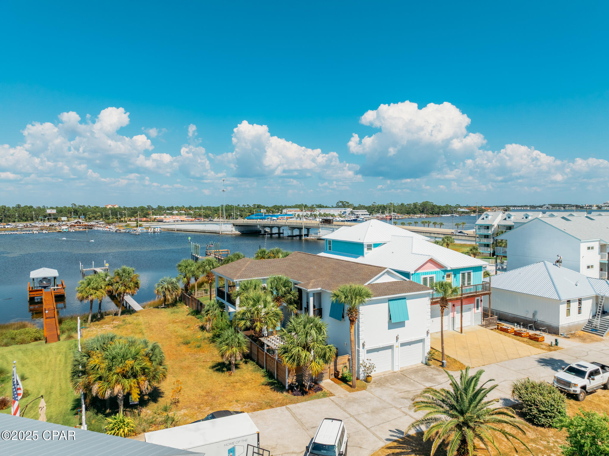 *CURRENTLY UNDER CONTRACT, SELLER WILL CONSIDER BACKUP OFFERS*

Waterfront homes with deep-water Gulf access are uncommon. A waterfront home built with Insulated Concrete Form (ICF) construction is a rare opportunity. Set on 52 feet of direct waterfront along Lower Grand Lagoon, this thoughtfully updated 4-bedroom, 4.5-bath residence offers 2,714 square feet designed for boating, entertaining, and everyday coastal living. Built with exceptional strength, energy efficiency, and storm resilience, this home combines quality construction with one of Panama City Beach's most desirable waterfront settings.

Unlike many waterfront homes, this property offers a floor plan designed with privacy in mind. Each of the four spacious bedrooms features its own ensuite bathroom and private balcony, creating comfortable accommodations for owners and guests alike. The updated kitchen showcases quartz countertops, new and refinished cabinetry, a bold navy island, stainless steel appliances, and generous storage. The primary suite overlooks the lagoon and includes a sitting area, a walk-in closet, a private balcony, and a beautifully renovated bathroom completed in 2025. One secondary ensuite bathroom was also renovated in 2025, complementing the home's timeless finishes, including tile flooring throughout the main living areas and bamboo hardwood in select upstairs spaces.

Recent improvements provide confidence for the next owner, including a 2019 roof, two HVAC systems installed in 2019, a 2025 renovation of the kitchen, primary bathroom, and one secondary ensuite bathroom, a saltwater pool deck resurfaced with a premium RevaFlex Limestone finish completed in 2026. These thoughtful investments allow the next owner to spend more time enjoying the home and less time planning future projects.

Life here revolves around the water. Begin the day with coffee on the covered veranda as the sun rises over Lower Grand Lagoon, launch a paddleboard or kayak from your backyard, spend the afternoon boating to Shell Island or one of the area's favorite waterfront restaurants, then return home for a swim in the pool before heading back out for an evening cruise. Dolphins are frequent visitors, anglers regularly catch speckled trout, redfish, mangrove snapper, flounder, and mullet in the surrounding waters, and seasonal Grand Lagoon fireworks can often be enjoyed from the property.

The property does not have a dock yet, offering a future owner the opportunity to design and install one tailored to their boating needs, subject to applicable permitting and approvals. Deep-water Gulf access makes this an exceptional setting for those who enjoy spending time on the water.

Additional features include a two-car garage, no HOA, sprinkler system, and a location just minutes from St. Andrews State Park, Shell Island, marinas, shopping, dining, Naval Support Activity Panama City, Tyndall Air Force Base, and Northwest Florida Beaches International Airport (ECP). Short-term rentals are currently permitted in this area; however, this home has been enjoyed as a primary residence and has not been operated as a vacation rental. Buyers should verify current regulations and intended use.

Some homes offer waterfront views. This home offers a waterfront lifestyle built around quality construction, thoughtful updates, and easy access to everything that makes Lower Grand Lagoon special. Whether you're boating to Shell Island, casting a line from your backyard, enjoying the morning sunrise over the lagoon, or relaxing beside the saltwater pool, this home is designed to be lived in and enjoyed for years to come.

Strong construction. Deep-water Gulf access. Thoughtful updates. Exceptional waterfront living. Opportunities to own an ICF-built home on Lower Grand Lagoon are rare.