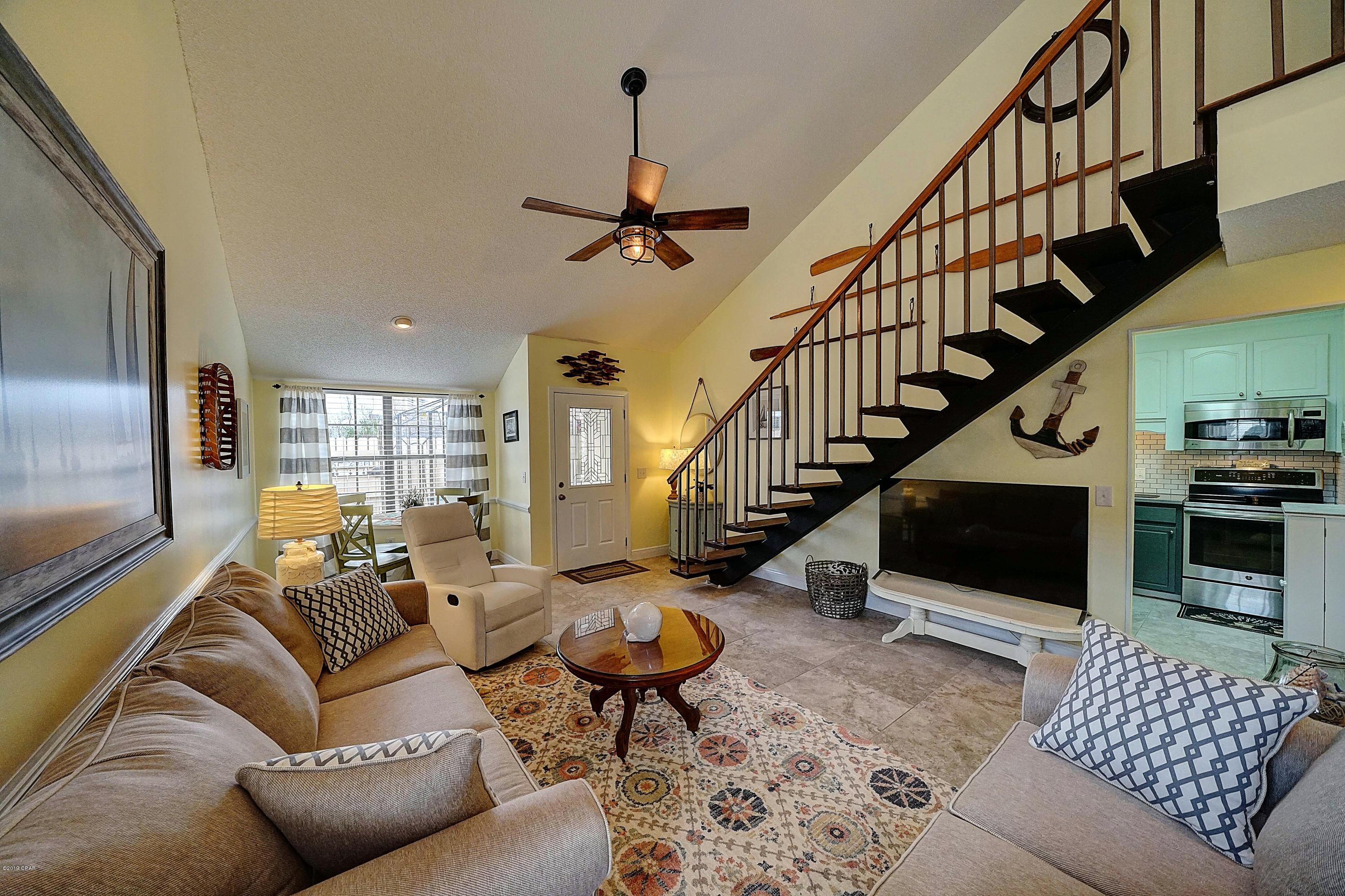 Stunning condo with beautiful updates and furnishings.  Own a slice of paradise in the gated resort of Horizon South! Location is everything and this one is perfect - just around the corner from the south pool and close to the beach. Corner location with enclosed patio complete with grill and outdoor seating. The interior has been freshly painted and features tile throughout 1st floor, attractive light fixtures and decor, washer/dryer, kitchen has quartz countertops, new stainless steel appliances, additional cabinetry, and more! 1st floor bedroom has a relaxing king size bed. Upstairs you will find a spacious bedroom with on-suite bath, walk-in closet and two queen size beds. For extra company, the living room has a sofa sleeper. Horizon South is a popular gated resort community located in the west end of Panama City Beach (less than a mile from Pier Park) with 4 pools, hot tub, tennis courts, shuffle board, mini golf, exercise room and deeded beach access to the Gulf of Mexico. Pack your bags and bring your toothbrush, everything else you need is already here waiting for you. Don't forget your flip flops - the beach is just a short walk away! All info, age, Square Footage, lot and room sizes approximate, if important please verify.