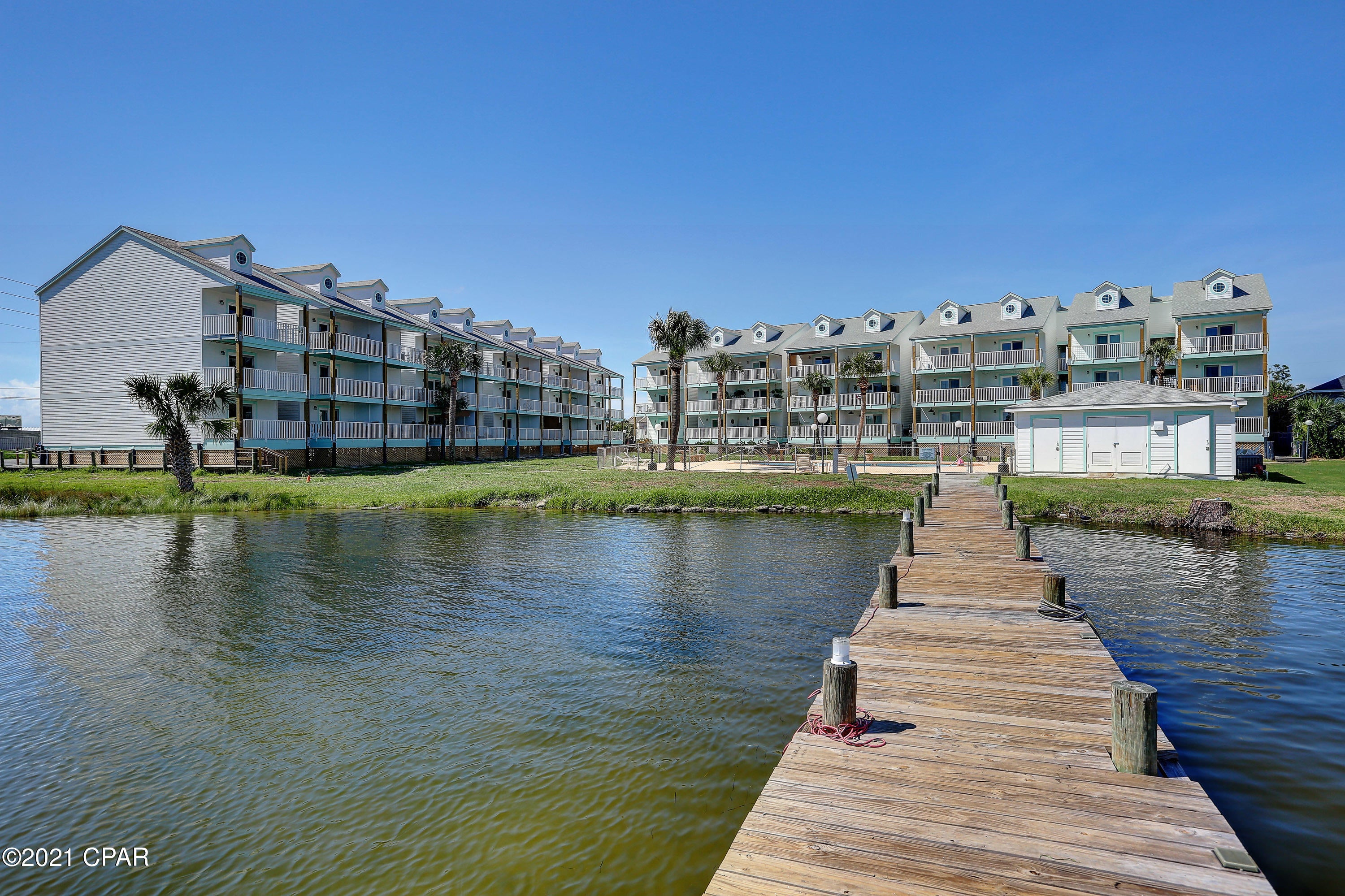 Grand Lagoon Waterfront third floor end unit. One bedroom with sleep loft, recently renovated . New roof, hardieboard  siding, white railing, fresh paint, outside lights, project sign, pool ,fence.windows,, doors, porthole skylight,  new support piling on water side. Unit in like new condition with new white kitchen cabinets,splashback tile,  quartz countertops, stainless steel appliances, Hunter ceiling fans, luxury vinyl plank flooring, new lights,bath vanity, mirror,subway tile and deep tub. all new fixtures.  8xv16 private balcony overlooking Lagoon .Prime beach location yet quiet setting on lagoon.  .  CAPTIAN Anderson's Marina , Treasure Island Marina, fine dining, public beaches, pontoon boat rentals, jet ski rentals , Charter boat fishing, golf courses, watersports, tourist attractions, scuba diving, charter boat fishing and all the recreational activities of Panama City Beach nearby. Stunning views from private balcony , top floor end unit.  Public parking and public beach access only one half mile from project.   Nice pool, landscaped grounds,and dock.parking by permit. Pets allowed .  Low HOA fees. Perfect waterfront location with public beaches and boat launch just a few blocks from project.  Close proximity to NCDS, Navy Base, golf courses, St Andrews State Park, Rick Selzer Park, shopping and public boat launch's.