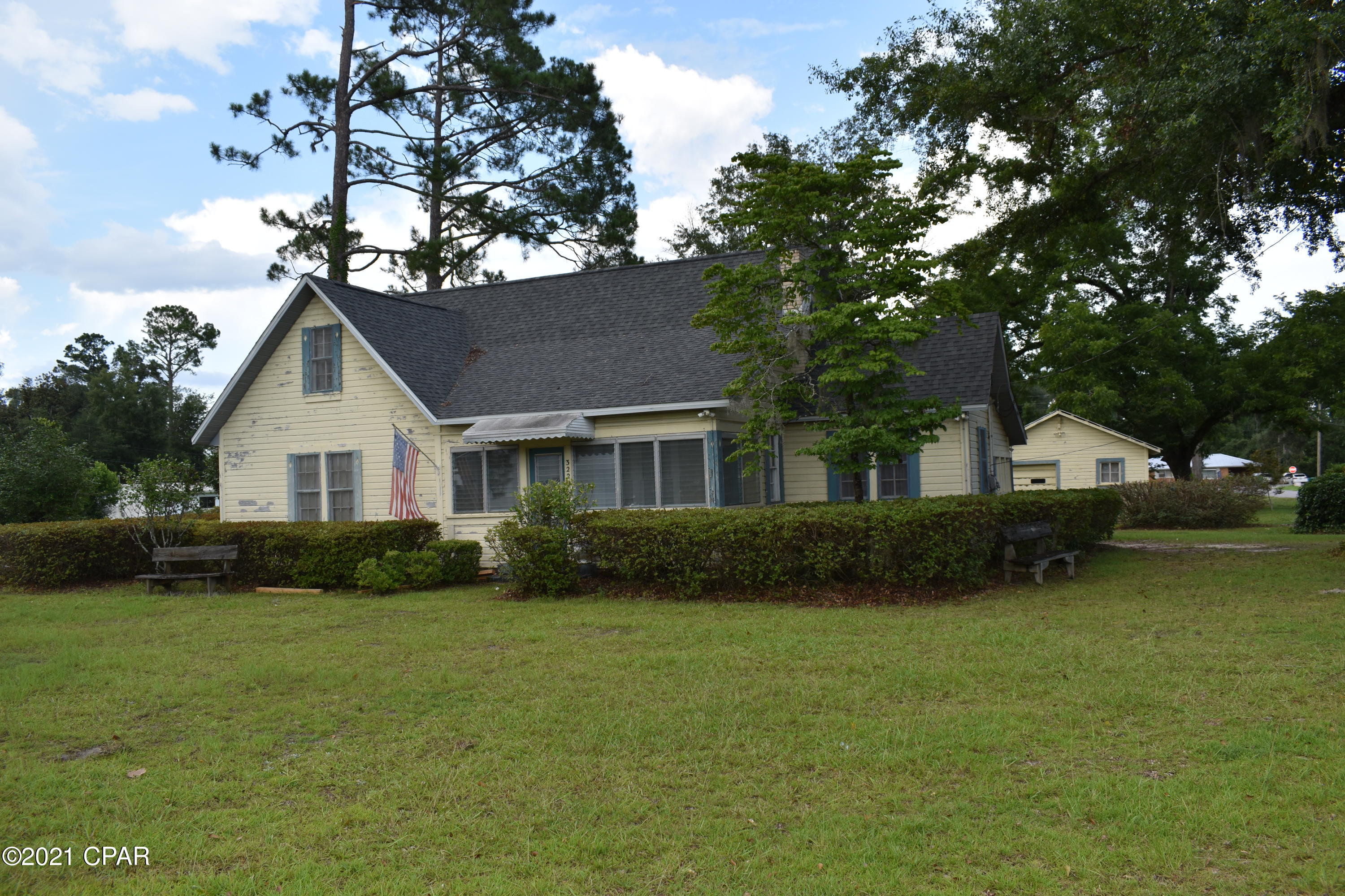At 3220 Main Street Cottondale, Florida sits this unique 3BR/2BA 2-story home. Its all ready for you to make it your own. Bring your favorite paint color, flooring etc. Exterior features are a newer roof, front porch sunroom, workshop and a carport that can be used as a patio.  All on a spacious/beautiful .87 city lot.