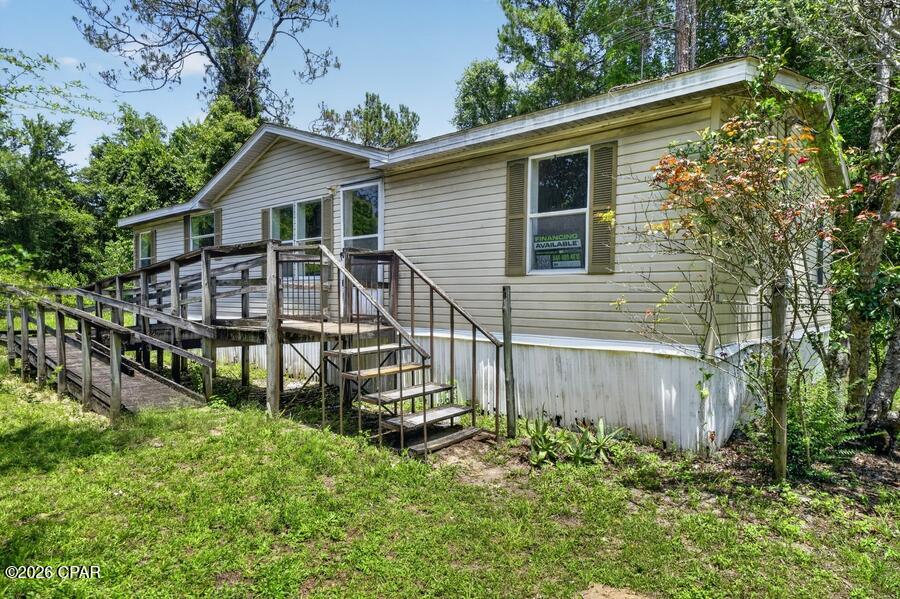 Handyman special with great investment potential! This manufactured home sits on a spacious 0.36-acre lot and is ready for your vision. The property needs repairs and updates, making it an excellent opportunity for investors, flippers, or buyers looking to build equity. Plenty of room for outdoor improvements and future value. Conveniently located in Sopchoppy and being sold as-is. Cash only. Don't miss this chance to transform a property with strong upside potential!