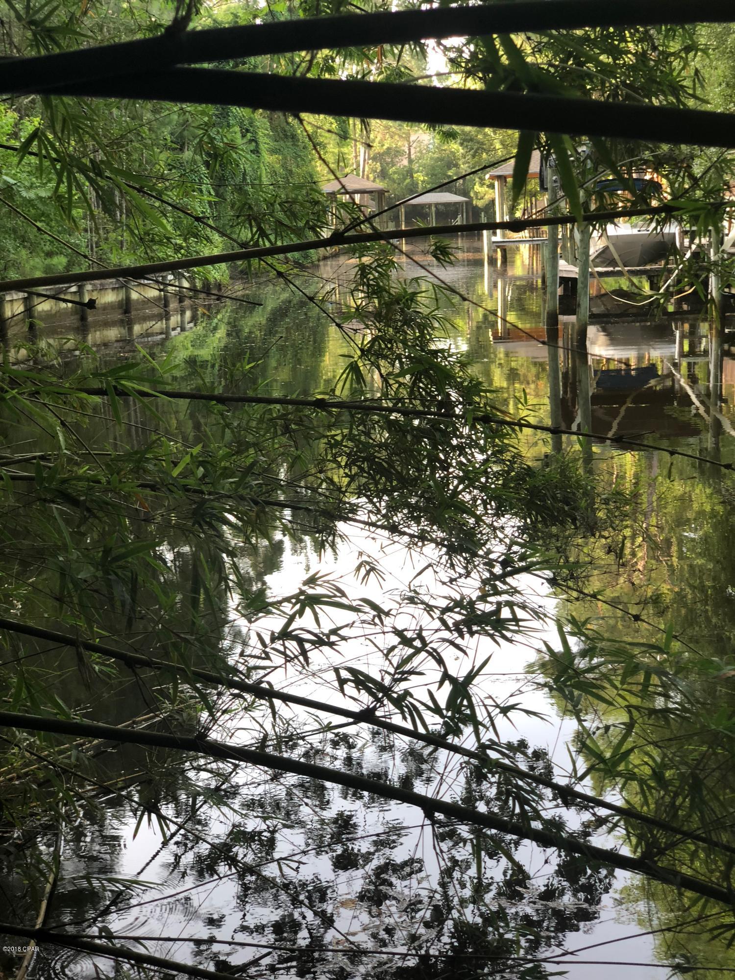 Builders dream waterfront property for less than$27,000 per door. Can build up to 6 units. 119 feet on the canal that is a short boat ride to bay, average water depth 8 feet in canal, all utilities on site, current old home site.  Home has no value. building lots.  Total of 4 parcels - 26794-101-000, 26706-010-000, 26706-000-000 and 26706-020-000. .  Four (4) lots. Most trees have been cleared.