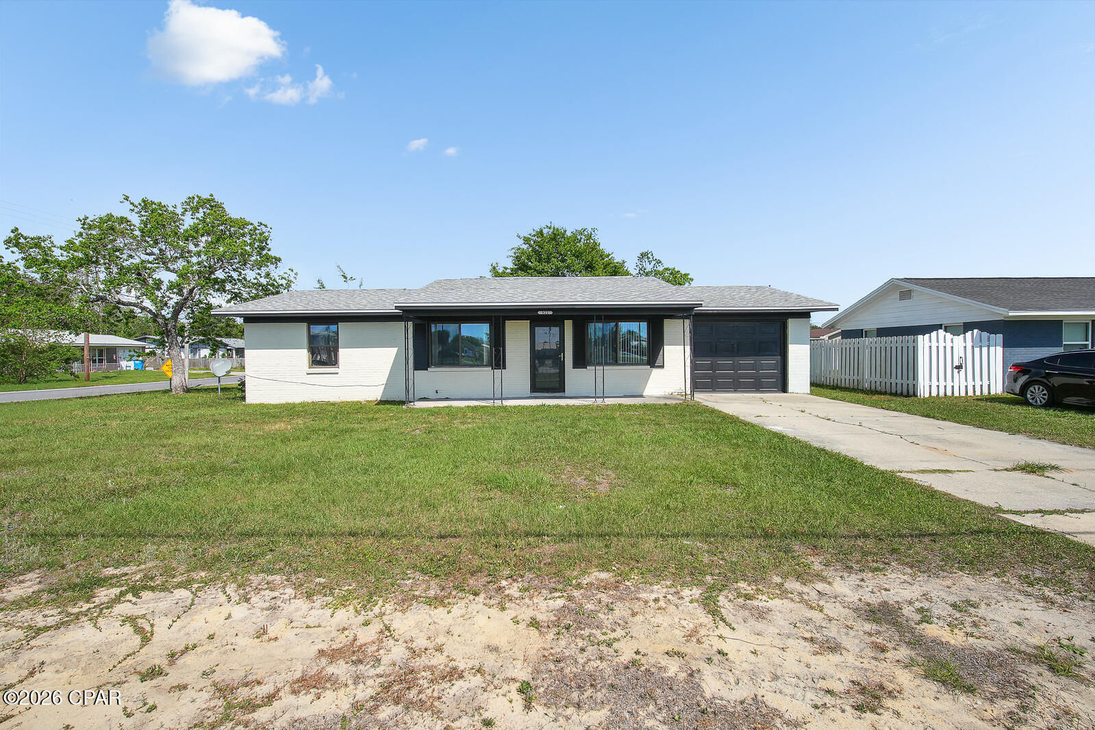 This solid brick 3-bedroom, 2-bath home. Enjoy a spacious, light-filled living area, generously sized bedrooms, and a handicap-accessible primary bathroom featuring a walk-in shower and grab bars. The kitchen offers abundant cabinet space, while the home features parquet flooring throughout--no carpet! Recent updates include new flooring, a remodeled bathroom, double-pane windows, a new A/C, and a new water heater, giving you peace of mind for years to come.

Outside, you'll find a beautiful corner lot with mature trees, a single-car garage with washer/dryer connections, and plenty of outdoor space to enjoy.

Schedule your showing today!