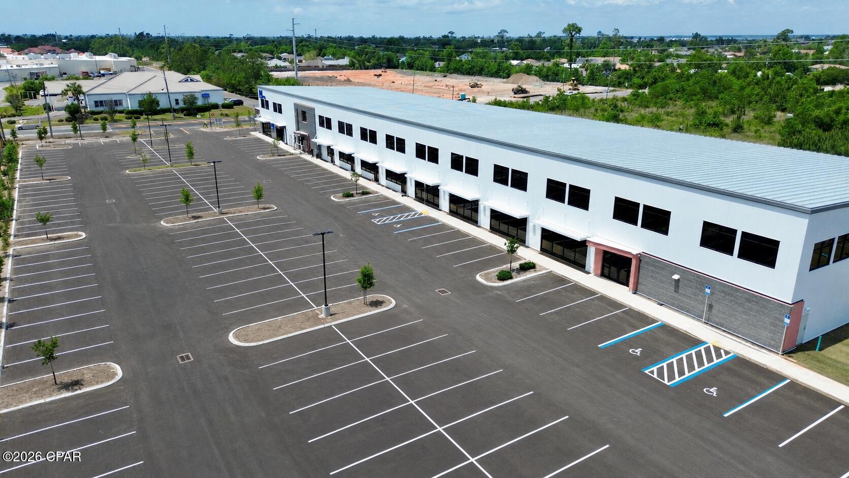 Leasing opportunity in brand new Class A construction at the heart of Panama City's premier medical and commercial corridor. Delivered in 2026 and situated one block from HCA Florida Gulf Coast Hospital, Gulf Coast Plaza offers ±24,016 SF of medical, office, and retail space available for lease at $28.00/SF/YR NNN, with a generous 5:1,000 parking ratio.

The property fronts the high-traffic 23rd Street retail corridor (±34,500 vehicles per day) and sits alongside major retailers including Target, The Home Depot, Lowe's, Walmart, and Publix.. Easy regional access via Harrison Avenue, Hwy 98, and Hwy 231.

Five build-to-suit spaces are available:

Space A - ±3,061 SF | Ground floor | Medical / Office / Retail  Uses: medical, dental, specialty practice, professional office.
Space B - ±11,763 SF | Ground floor | Medical / Office / Wellness / Fitness -- wide-open floor plan with high ceilings. Uses: fitness, recreation, medical, flex retail.
Space C - ±1,316 SF | Second floor | Medical / Office -- private suite ideal for administrative, professional, or specialty office users.
Space D - ±6,566 SF | Second floor | Office -- larger suite with flexible configuration for single- or multi-tenant use. Uses: medical, professional office.
Space E - ±1,310 SF | Second floor | Medical / Office -- compact suite ideal for a small office or specialty practice.