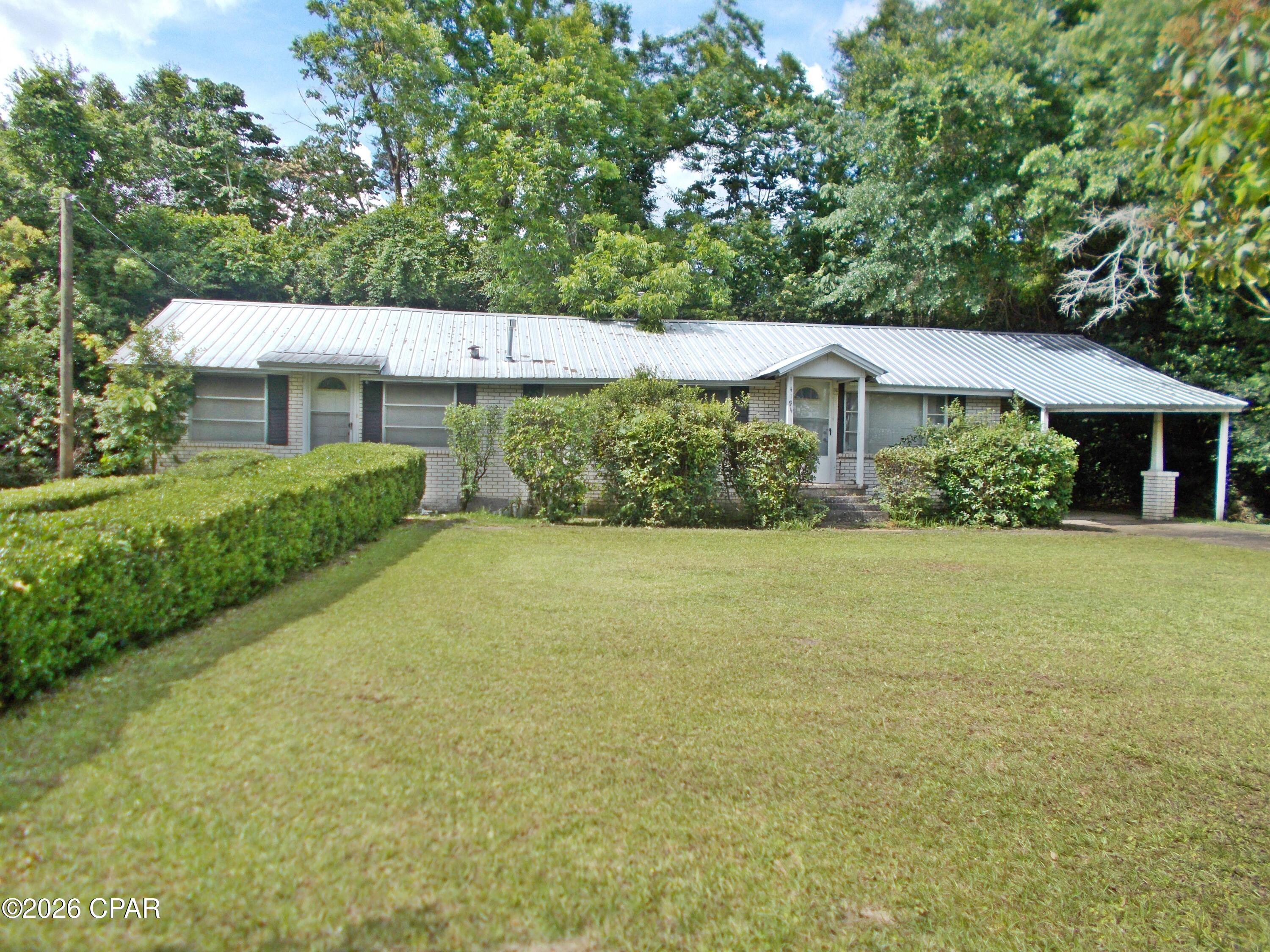 4/2 Brick home in the city limits, needs some TLC would be ideal to flip or live in. Large living room, family room dining room and kitchen. 4 bedrooms and a carport. Not easy to find at this price. There is a new gas water heater installed this year.