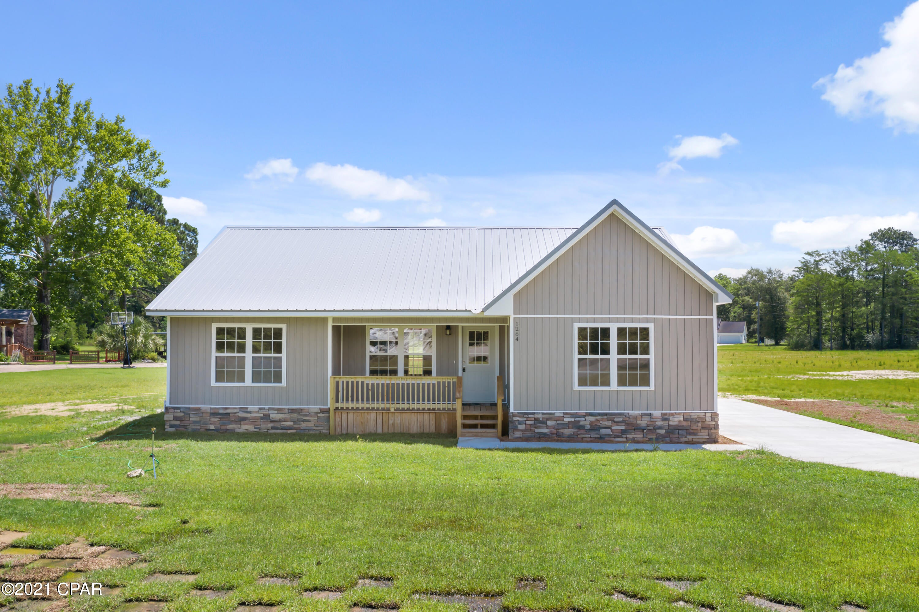 CURRENTLY UNDER CONTRACT, SELLER ACCEPTING BACKUP OFFERS - NEW CONSTRUCTION, CONVENIENCE, SOMETHING WITH ACREAGE - Now's your chance to check off those boxes on your checklist!!!!  This beautiful home has a split floor plan & sits on a corner lot with over 2 acres. It is  conveniently located on a paved road just north of downtown Chipley, where you'll find restaurants and shopping.  Gorgeous magnolia trees adorn the driveway & the seller has even planted a few peach trees.   Features include a metal roof, underground electric, vinyl plank flooring throughout, granite counter-tops, soft close cabinets & drawers in kitchen, a jacuzzi, walk in closet in master bedroom, & a large deck on the back for grilling your favorite meal.