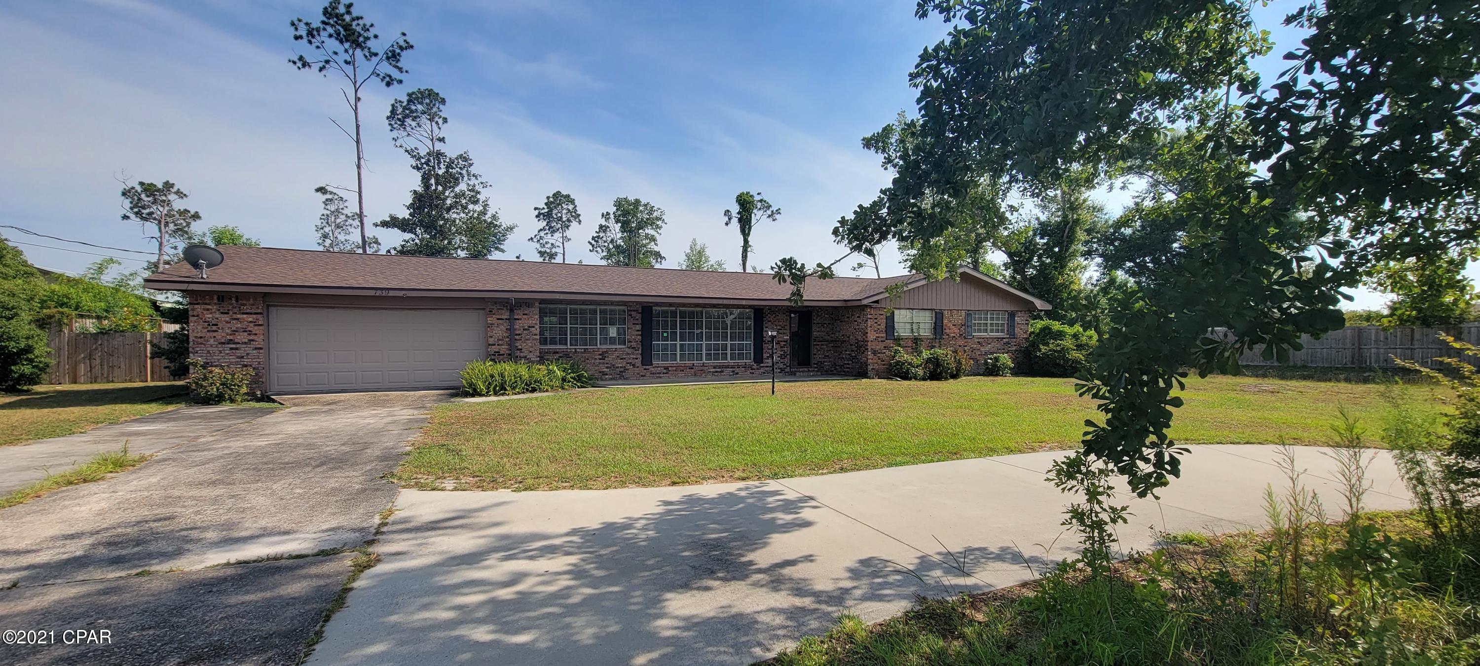 Brick ranch styled home situated on half acre + lot with huge privacy fenced back yard. 

If you want a quiet and serene setting this home is located at the end of Baywood Drive where thru traffic is non existent. There  is a long oversized driveway with plenty of room for boats , RV's and multiple vehicles. The oversized two car garage has lots of extra space for a workshop or storage. The living room is spacious, kitchen is eat in, and there is a cozy family room with wood burning fireplace.
