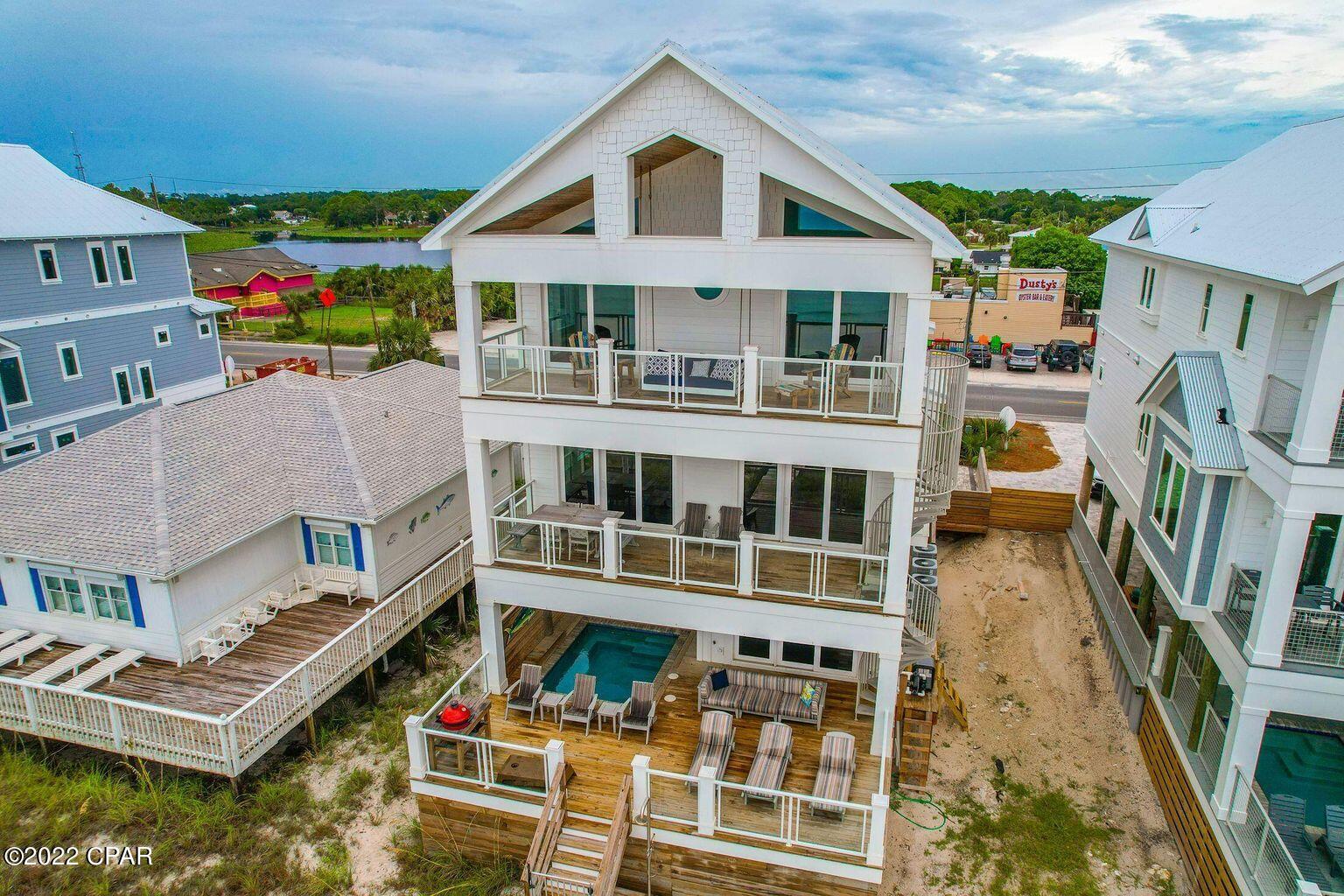 TURNKEY RENTAL MACHINE!!
''Pier Park Paradise'', is a beachfront home located on the West end of Panama City Beach. Just a short walk to some of the best shopping, restaurants and attractions in Pier Park! Across from Dustys! This beachfront home featured with a private beachside pool, private boardwalk and stunning ocean views from every angle (including the balcony bed swings)!



Just inside from the pool deck on the first floor is a seating area with flat screen TV, pullout queen sofa bed, foosball table and full bathroom. It's perfect for hanging out inside while still having an open view of the pool and grilling area. The sliding glass door opens up to an 8x12 private pool and has surrounding lounge chairs, outdoor games plus an outdoor charcoal grill. THIS IS A MUST SEE HOME!!