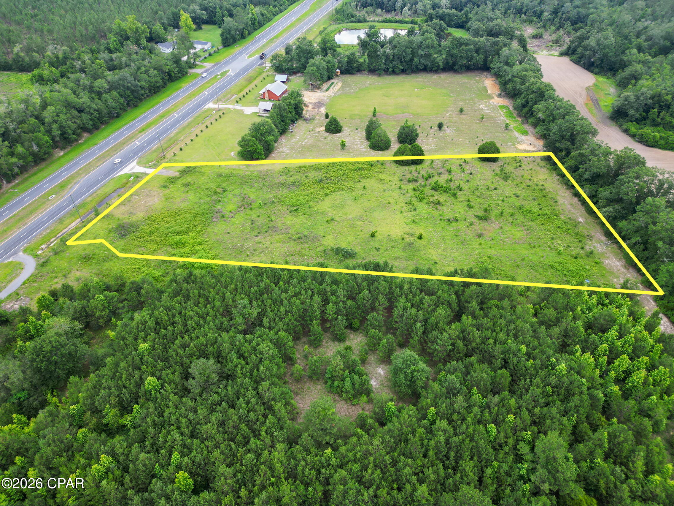 Just under 5 acres off Highway 77, already cleared and ready for your vision! This property is located less than 5 minutes from Interstate-10. The close proximity to the interstate is perfect for truck drivers or those who travel for work and the highway access is perfect for contractors and business owners who navigate large vehicles and trailers. Per Washington County Planning & Zoning, the current zoning of the property is Agriculture/Silviculture, which allows for one house to be built on the property, along with accessory buildings. Also, you would be able to have one accessory dwelling unit (this would be site built at 50% or less of the square footage of the primary structure.) The land is also located less than an hour from Panama City Beach, and with the highway expansion being completed on the majority of the drive down, it makes for an easy drive for a beach day!