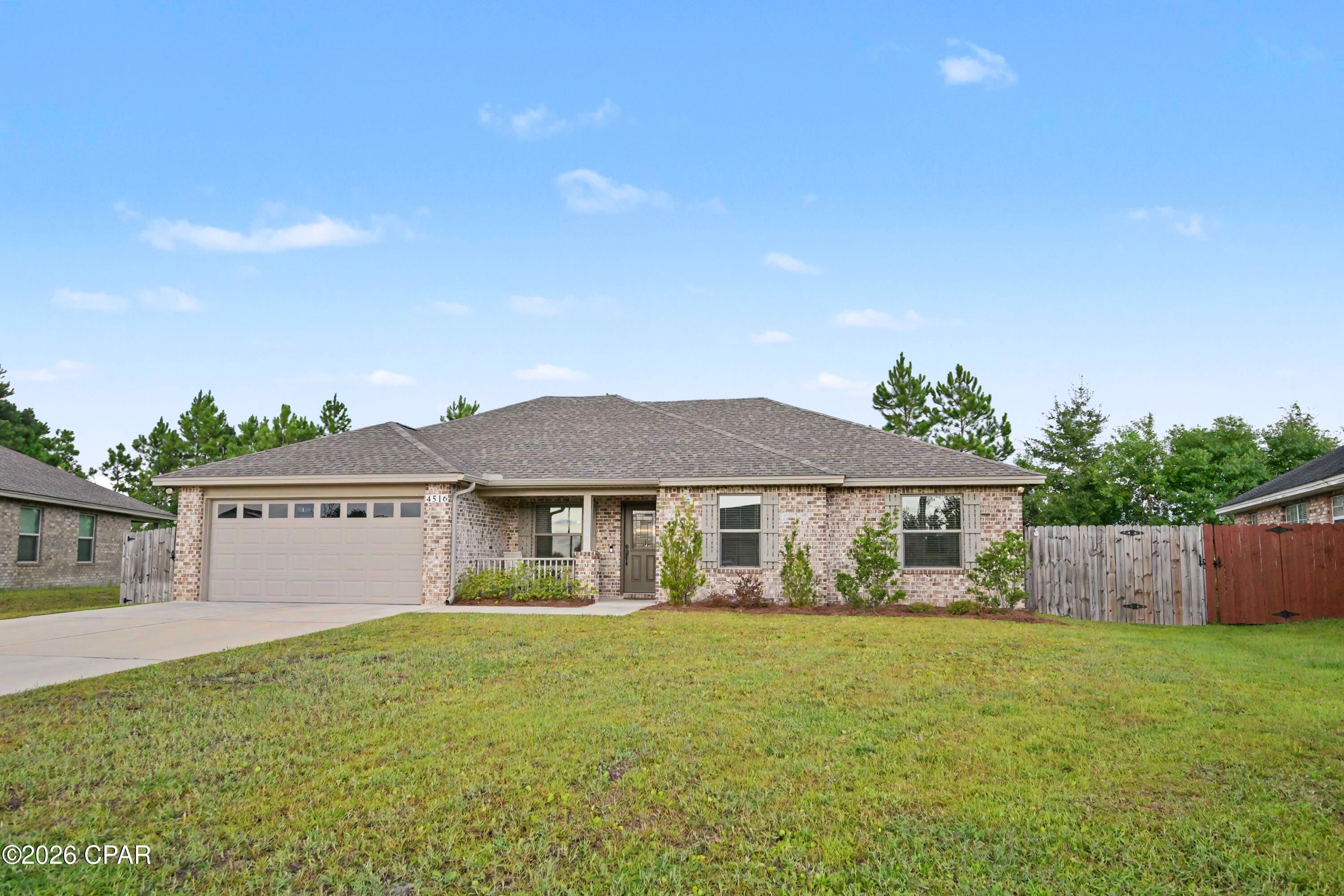 **Like-New All-Brick Home with Backyard Oasis & No HOA!** USDA eligible location!

Welcome home to this beautifully maintained 3-bedroom, 2-bath all-brick residence offering quality finishes, thoughtful upgrades, and an inviting open-concept layout. Located in a well-maintained neighborhood with **no HOA fees or restrictions**, this home provides the perfect combination of comfort, functionality, and freedom.

The spacious open floor plan features a large family room with an electric fireplace, creating a warm and welcoming gathering space. Luxury vinyl plank flooring flows throughout the home, offering a beautiful, durable finish. The kitchen is designed for both everyday living and entertaining with real wood cabinetry and stainless steel appliances.

The private primary suite is a true retreat, featuring tray ceilings with rope lighting, a generous walk-in closet, and a beautifully appointed bathroom with a **walk-in rain shower, built-in seat, and double vanity**. The additional bedrooms are generously sized and offer ample storage with large closets featuring triple-door configurations.

Step outside to your own backyard oasis, complete with a covered patio that extends the living space outdoors. A convenient hot-and-cold outdoor shower adds an exceptional touch for rinsing off after outdoor activities or enjoying the backyard year-round.

Additional features include an oversized 2-car garage, emergency generator hookup, irrigation/sprinkler system, fiber optic internet, adorable garden, and security system. From the curb appeal of the all-brick exterior to the thoughtful interior finishes and beautifully maintained outdoor spaces, this home is truly move-in ready.

**No HOA fees. No HOA restrictions. All the benefits of a well-kept neighborhood without the added limitations.** This exceptional home is ready for its next owner--schedule your private showing today!