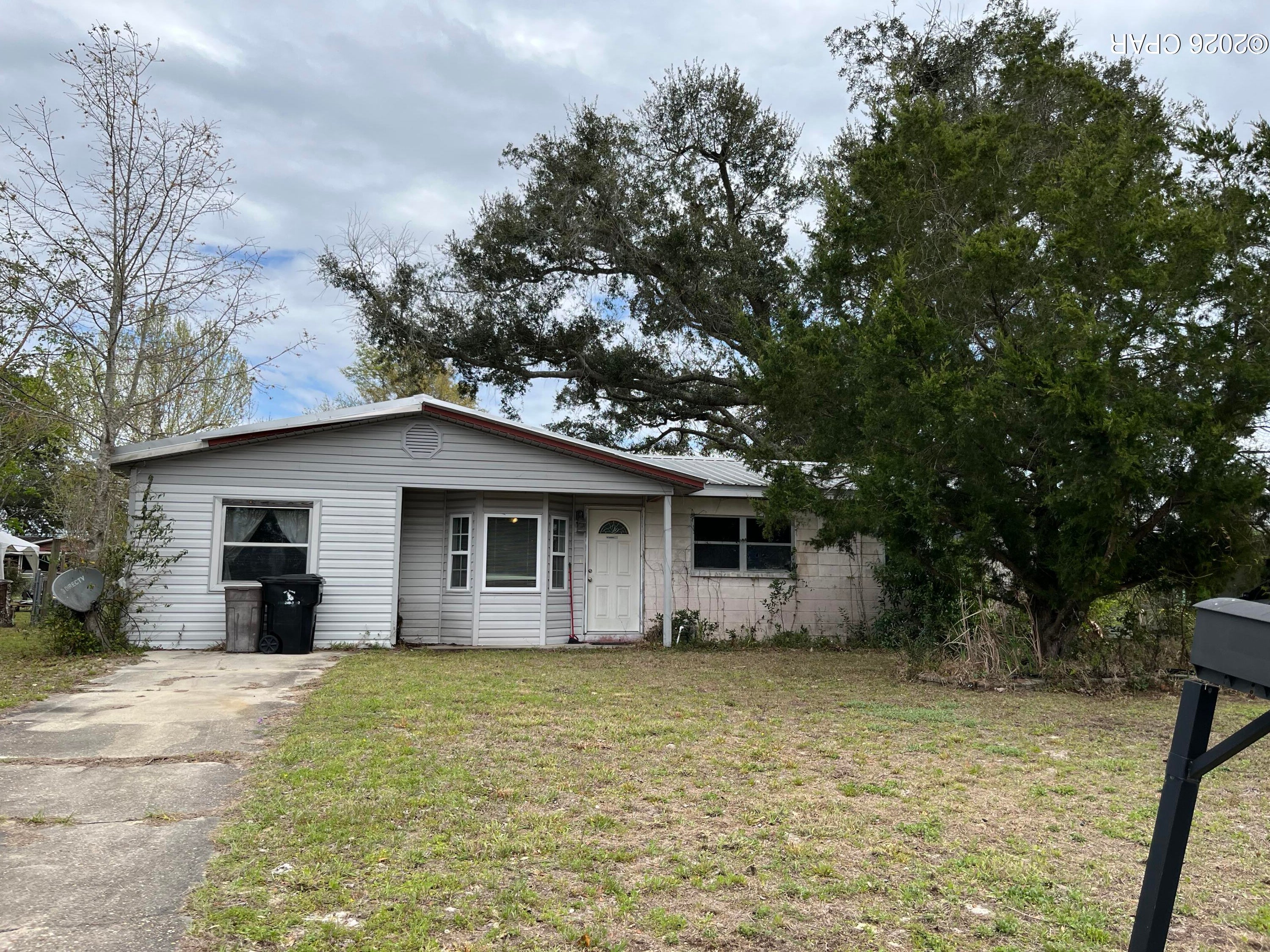 Fixer Upper. Sturdy water tight block home.  This 4 bedroom 1 bath ranch home is ready to be updated. It has a large screened patio, that needs to be redone. There's also a large storage shed with electric. The property has a nice large yard. With some sweat equity this home is ready for new owners.