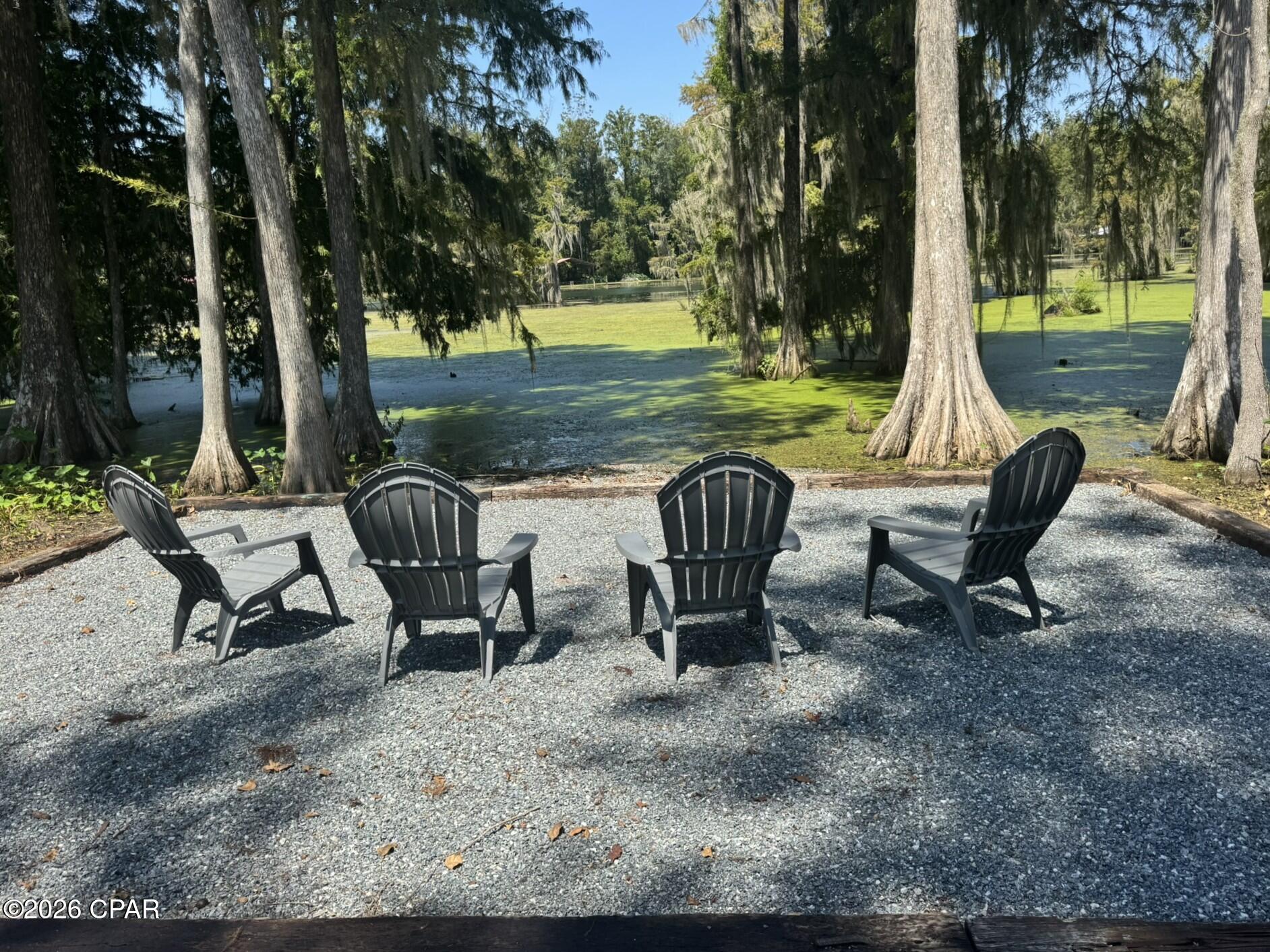 Rare opportunity on beautiful Merritt's Mill Pond! This 2.55-acre property offers a phenomenal homesite in one of Jackson County's most prestigious and desirable areas.
Merritt's Mill Pond is known for its stunning, crystal-clear spring water that is cool and refreshing year-round. Fed by Jackson Blue Spring and other natural springs connected to the Floridan Aquifer, the pond offers an incredible setting for swimming, boating, kayaking and fishing. Its unique underwater springs and cave systems also attract cave and cavern divers from near and far.
The property provides direct access to Merritt's Mill Pond with potential for a private dock, subject to applicable permitting and approvals. With 2.55 acres to create your dream homesite, you can enjoy the privacy and space of your property along with access to one of Northwest Florida's most unique spring-fed treasures.
As a natural spring-fed ecosystem, the pond can experience temporary periods of vegetation growth, with conditions changing as the vegetation naturally clears, revealing the CRYSTAL-CLEAR, cool and refreshing spring water that Merritt's Mill Pond is so well known for.
2.55 acres, spring-fed water, incredible recreation and an exceptional location--come experience what makes Merritt's Mill Pond such a special place to call home! An added BONUS is that it is conveniently located down the road from Indian Springs Golf Club. (same neighborhood) An 18-hole, par-72 course playing up to about 7,013 yards, with multiple tee sets. It is a public/semi-private and open to guest play. It also has a driving range and putting green, along with cart and club rentals. This is a must see property!!
