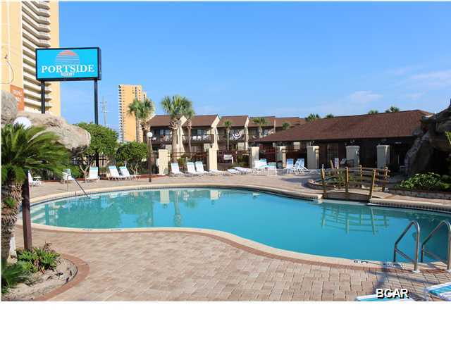 NON-RENTAL UNIT IN PORTSIDE!! This fully furnished condo is worth a look. This unit has the wooded area in the back for privacy, a pool right around the corner and convenient to all the complex has to offer. It is one of the cleanest units in Portside. This well landscaped complex is perfect for those not wanting high-rises, crowded pools and long lines for the elevators. You feel relaxed from the time you drive in. You park at your front door and the fun begins. There are three pools, water falls, club houses for social gatherings, tennis courts, shuffle board, onsite management, beach access right across the street. Come see this beautiful condo today! Click on the picture above to see more. (all information approximate, if important please verify)