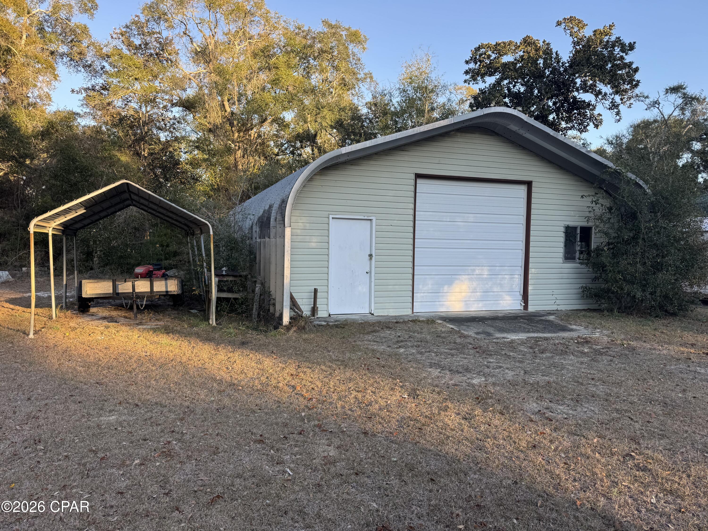 Beautiful lot with warehouse!  Location is at Steelfield Fish Camp in Walton County, just 25 min from Pier Park off Hwy 79.  Steelfield Fish Camp is one of the most beautiful and peaceful places in NW Florida.  This community is paradise for someone looking for a place to access the Choctawhatchee River, surrounded by hunting land, close proximity to the InterCoastal waterway with riding leases for your side-by-side and plenty of other activities to fill your days!  This listing features a 30 x 50 warehouse with two 12ft roll-up doors, concrete floor, no leaks, surrounded by beautiful heritage oak tree and grassy wide open spaces ..just waiting for your RV or weekend getaway!  ADDITIONAL ADJACENT PROPERTY AVAILABLE.  Three additional lots available for $75k see MLS 793505.
Listing agent is related to owner.