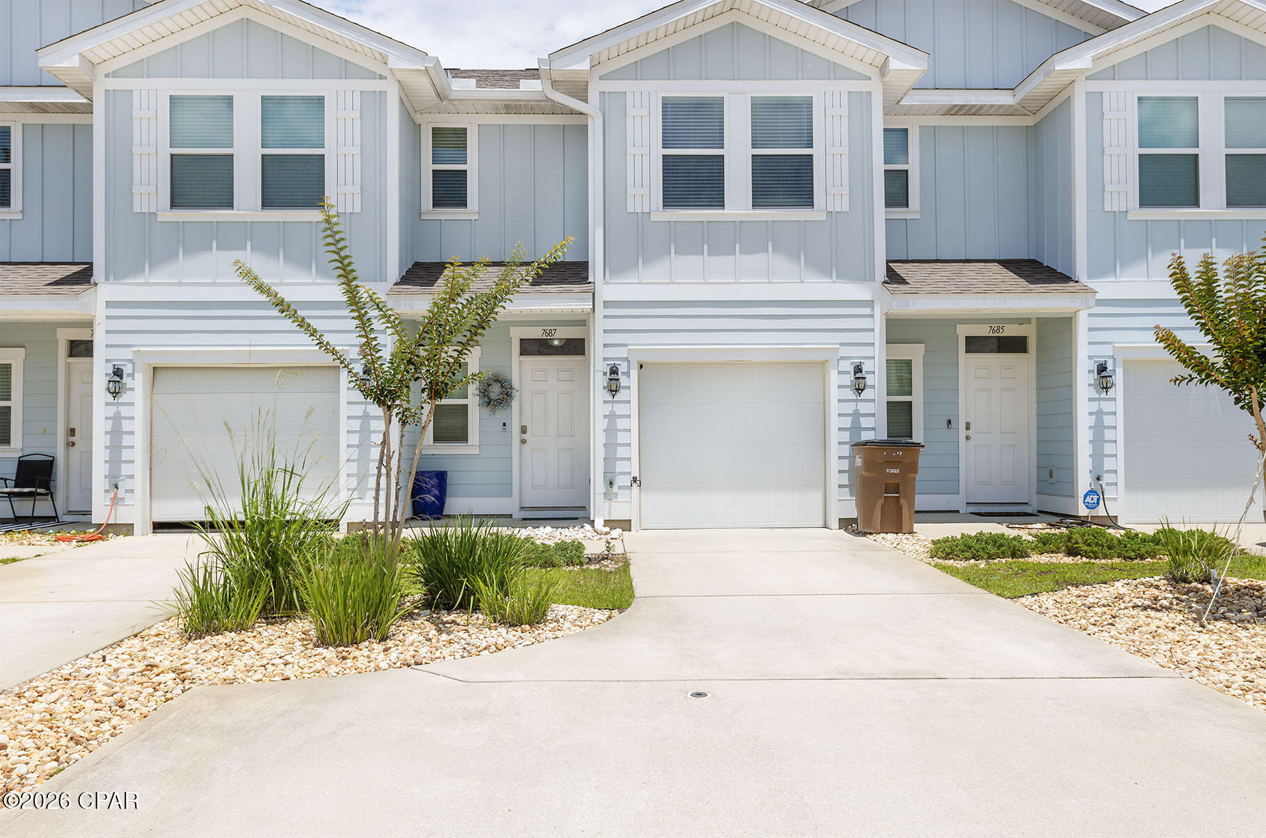 Welcome to your slice of coastal paradise at 7687 Shadow Lake Drive in beautiful Panama City Beach!  This charming 3-bedroom, 2.5-bath home, built in 2020, perfectly blends modern style with laid-back beach living. With nearly 1,500 square feet of thoughtfully designed space, you'll love the open-concept layout that's ideal for entertaining or simply relaxing after a day on the water.  The bright and airy kitchen features sleek finishes, ample cabinetry, and a spacious breakfast bar that flows seamlessly into the living and dining areas--perfect for hosting friends and family. Upstairs, the private primary suite offers a peaceful retreat, complete with a generous walk-in closet and en-suite bath. Two additional bedrooms provide flexibility for guests, a home office, or a growing family.  Step outside and enjoy your low-maintenance yard or take advantage of the community amenities, including a sparkling pool just steps away--perfect for cooling off on those warm Florida days.  Located just minutes from the world-famous sugar-white sands of Panama City Beach, dining, shopping, and entertainment, this home offers the perfect balance of convenience and coastal charm.  Contact your favorite Realtor to set up a showing today!
