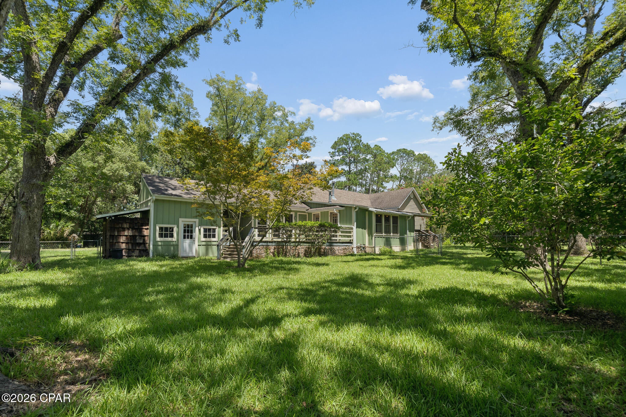 Welcome to this charming 3-bedroom, 1.5-bath home conveniently located in the heart of Chipley, Florida. Just minutes from shopping, dining, and everyday conveniences, this property offers both comfort and convenience. Step inside to an inviting entry featuring custom wood-beamed ceilings and a beautiful sliding barn door, creating a warm and welcoming space that can serve as a cozy sitting area or elegant dining room. The kitchen is filled with natural light and showcases unique brick accents, adding character and charm. The spacious open-concept living area provides an ideal setting for relaxing or entertaining family and friends. Situated on a large corner lot, the property features a generously sized, fully fenced backyard with plenty of room for children, pets, gardening, or future outdoor amenities. Located in one of Chipley's growing areas, this home offers an excellent opportunity for first-time homebuyers, downsizers, or investors alike. Don't miss your chance to own this beautiful home. Schedule your private showing today and experience all this property has to offer!