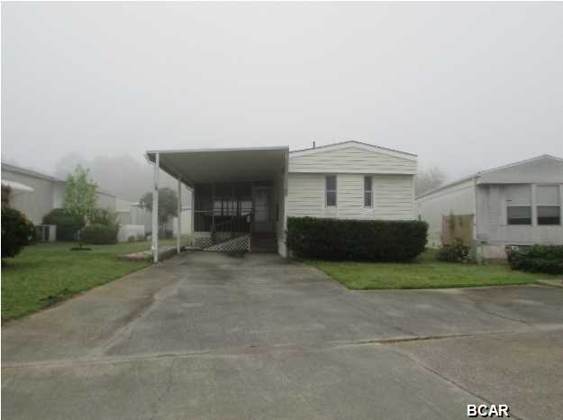 Singlewide mobile home offers a formal living room, split planned master suite w/full bathroom, kitchen/dining combo that opens to a sunroom, screen porch w/hot tub, and both bathrooms are handicap modified! Super convenient location tucked in between Panama City Beach Pkwy., and Front Beach Rd-meaning super easy access to tons of amenities and restaurants, plus you are just a few minutes from the bay, the beaches, and Saint Andrews State Park! *This is a 55+ community with no children allowed. EQUAL HOUSING OPPORTUNITY.