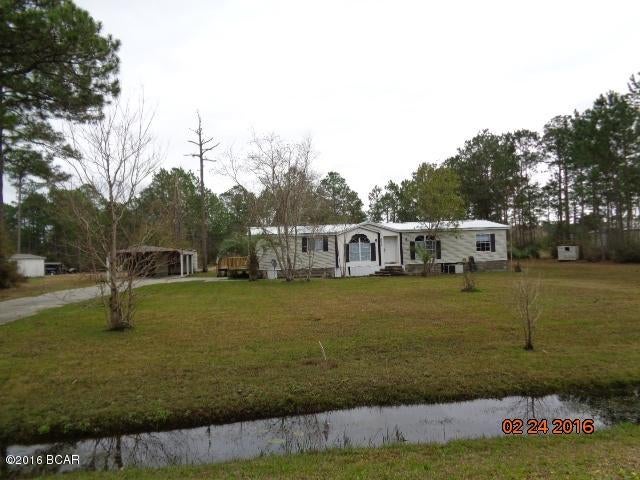 1993 DWMH IN GOOD CONDITION LOCATED ON 2 ACRES+- ON PAVED ROAD.  There is a detached 2 car carport with 12'x 20' shed attached to the carport. lots of open space and with a small fishing pond on the back of the property. Info from property appraiser website, Please verify if important. THIS IS A MUST SEE HOME. CALL FOR APPOINTMENT TODAY,