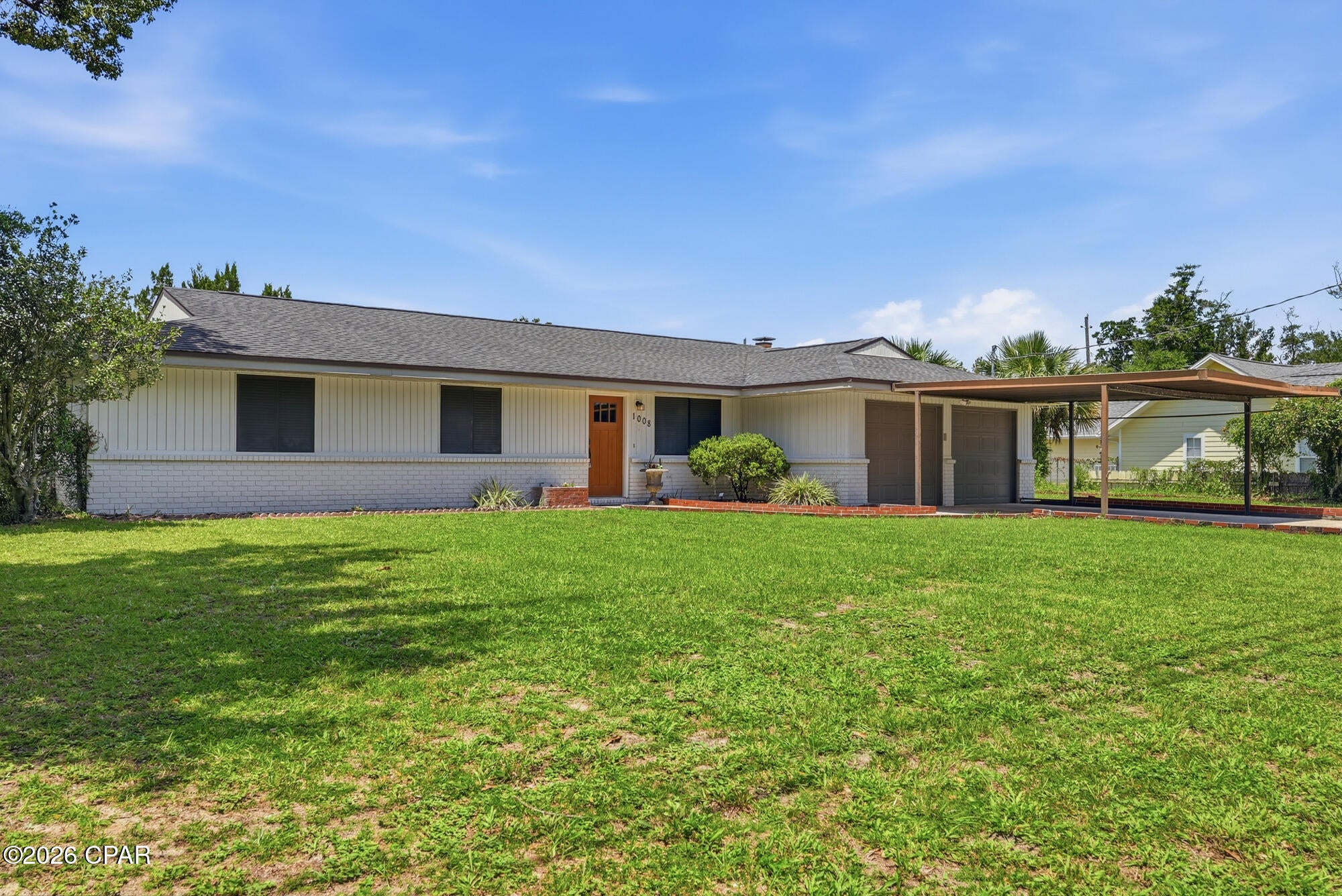 LYNN HAVEN classic brick POOL home situated on a spacious 100x150 lot with no HOA and no required flood insurance. The property is ideally located within walking or golf cart distance of waterfront parks, the local Farmers Market, City Hall, and area shopping and dining, plus highly rated local schools. Inside, the home has been updated with luxury vinyl plank flooring, stainless steel appliances, and beautiful custom wood cabinets. The kitchen showcases granite countertops and a breakfast bar complete with a sleek range hood. A highly flexible floor plan offers a separate living area alongside a great room off the kitchen that includes dedicated dining space and a full brick wall wood-burning fireplace.Additional space includes a bonus room leading to an extra area that works perfectly as a home office or a fourth bedroom with direct pool access. For outdoor living and entertaining, a massive 35x14 enclosed porch overlooks the pool area. Also, a  fully fenced backyard and a 2 car garage add more livability to this value packed property!