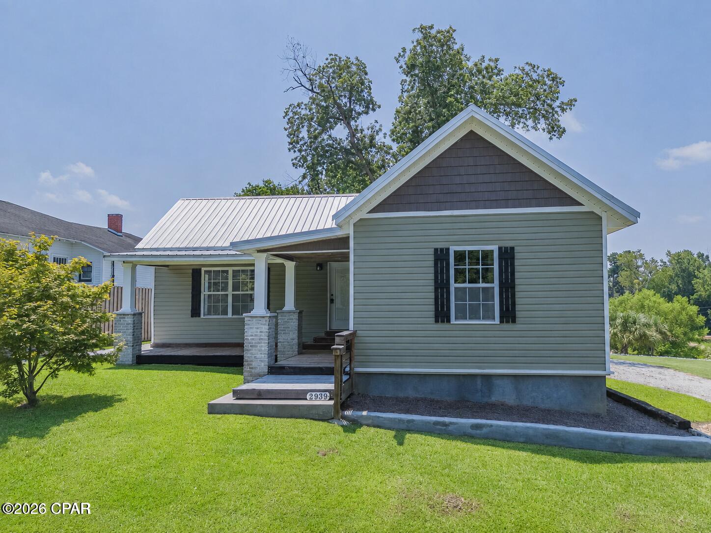 Welcome to 2939 Caledonia Street in Marianna, Florida--a beautifully restored home that perfectly blends timeless character with modern updates. Originally built in 1920 and updated in 1955, this home has recently undergone a complete owner-remodel with quality craftsmanship throughout. Step inside to discover an inviting open-concept floor plan that seamlessly connects the living, dining, and kitchen areas, creating an ideal space for everyday living and entertaining. The stunning kitchen features brand-new Shaker-style cabinetry, elegant granite countertops, and a fresh, modern design. This home has been extensively updated for comfort and peace of mind, including all new plumbing and electrical systems, a new water heater, new dishwasher, and a new HVAC system installed in 2024. One detail you'll immediately appreciate is the solid construction--this home has **no creaks or squeaks**, reflecting the care and attention given during the renovation. If you're looking for the charm of a historic home without the maintenance concerns, this move-in-ready property offers the best of both worlds with modern conveniences, thoughtful upgrades, and lasting quality. Don't miss the opportunity to make this beautifully remodeled Marianna home your own!
