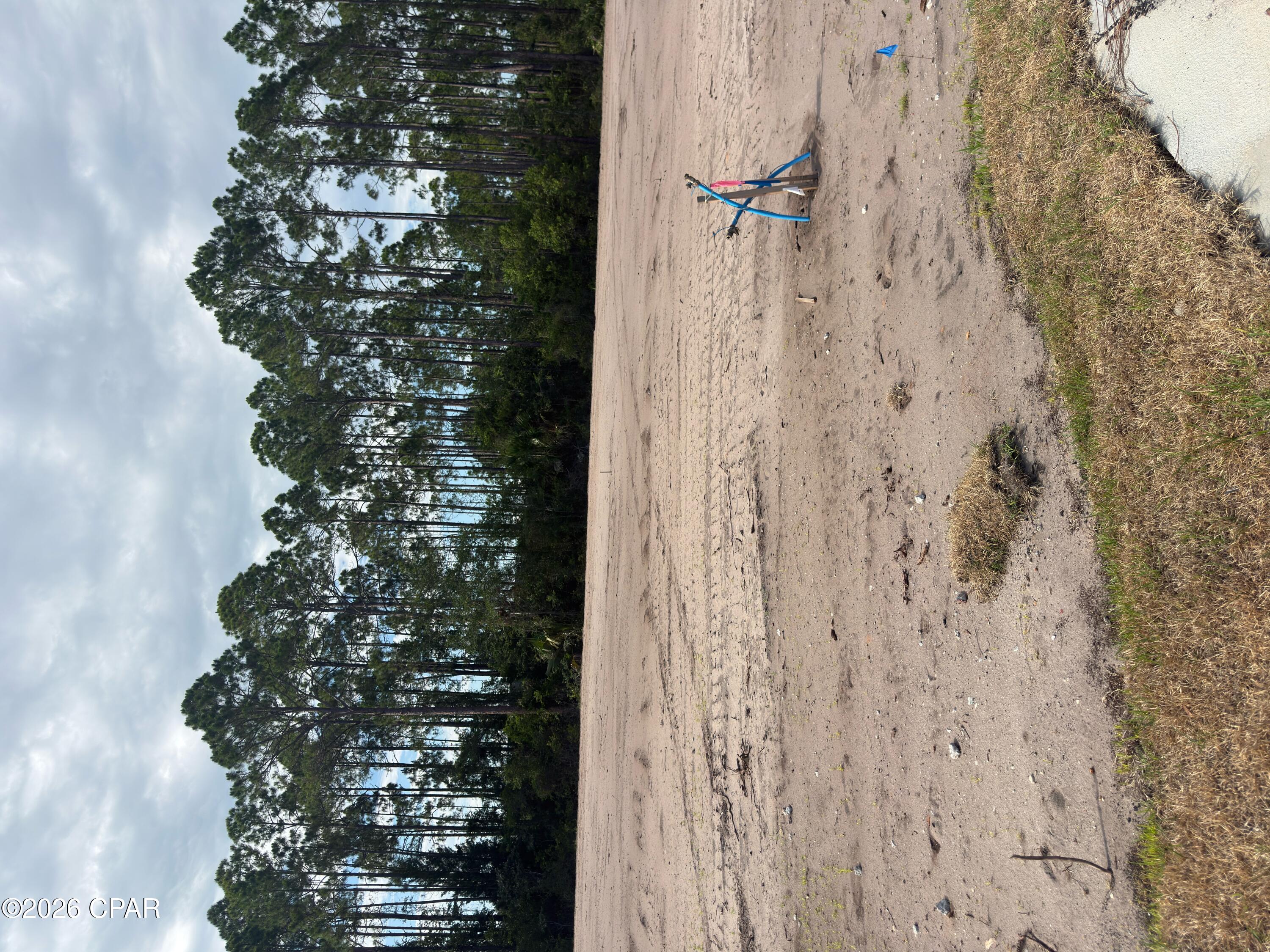 Port St Joe's newest gated and landscaped community with all the possibilities one could ask for. These lots are all X FLOOD ZONE and are eligible for SHORT TERM (DAY, WEEK, OR MONTHLY) or LONG TERM RENTALS. One can legally GOLF CART to Downtown or have easy access to St Joseph Bay. All lots are cleared and ready to build on with no timeframe to for building. Amenities already in place area; Paved street with ribbon curbing, entrance with signage and landscaping, sodded entry on Garrison Ave, water, sewer, under ground electric, elegant street lights for security. Amenities to be installed by the developer are privacy fencing, gated entry and bamboo accents for a border. Subdivision is under the County building and zoning regulations, not The City of Port St Joe.