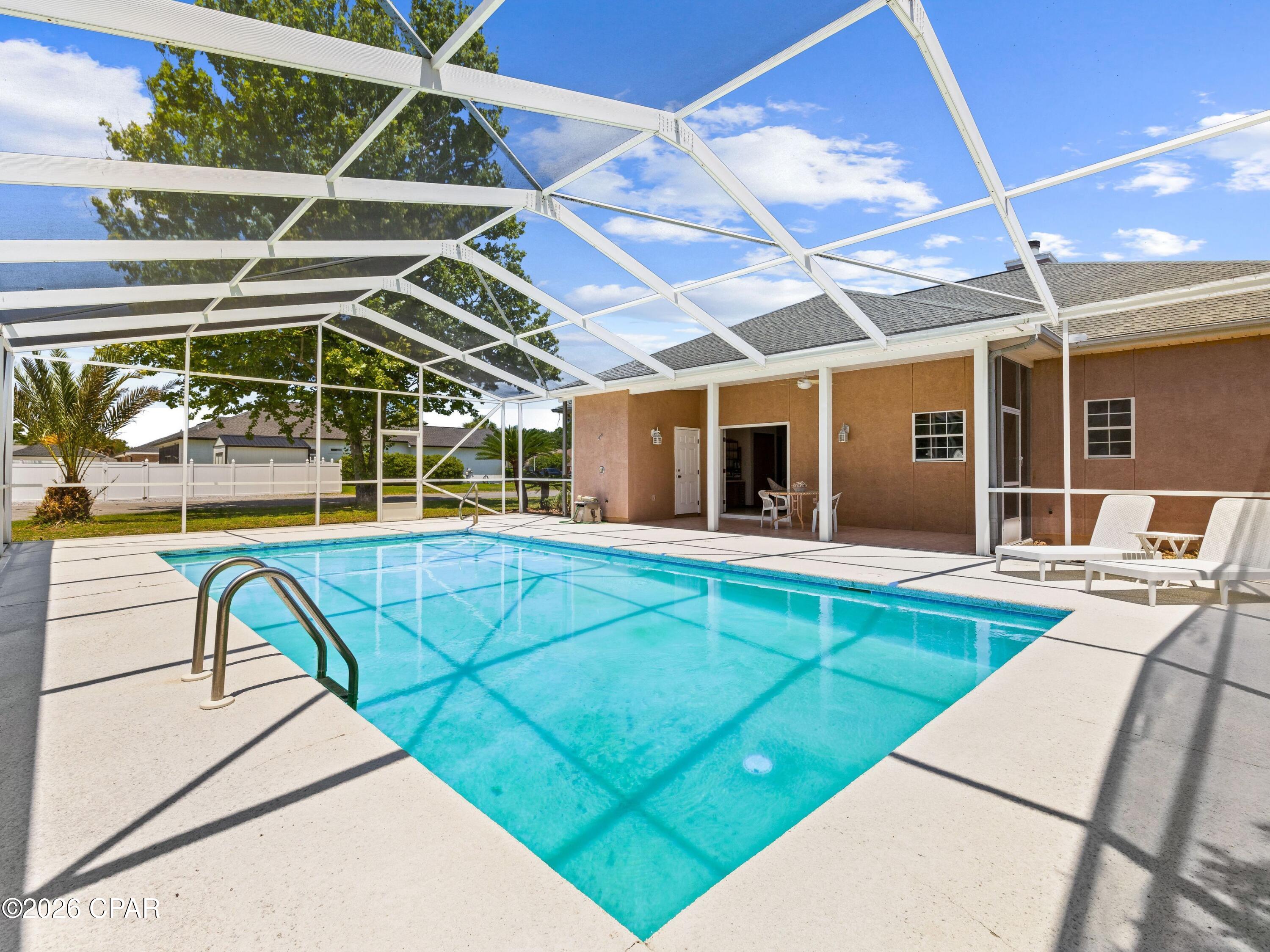 Positioned on an oversized corner lot on the desirable west end and just a short walk to the beach, this three-bedroom, two-and-a-half-bath home presents a compelling opportunity for those looking to create value in a prime location. Just a short distance to the beach, the property offers strong fundamentals with a private pool, two-car garage, and key system updates already in place, including a newer roof , HVAC, and water heater.  With its generous footprint and sought-after location, this home is ideal for investors or buyers with vision looking to reimagine a property to its full potential.Whether you're considering a primary residence, second home, or investment opportunity, the combination of lot size, location, and core improvements makes this a standout value-add opportunity on the west end.