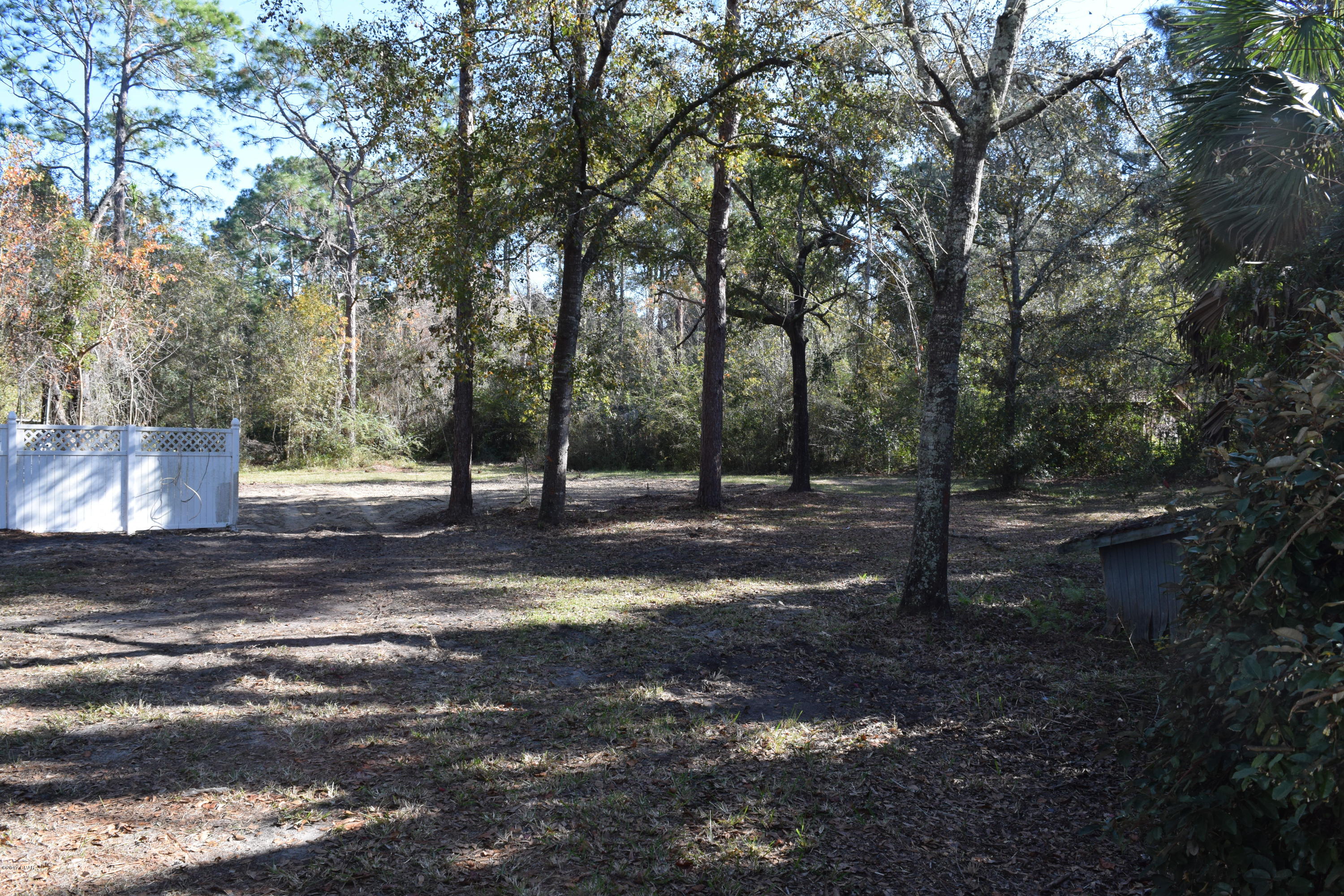 Vacant lot with amazing potential. This lot has a large workshop on it and a huge covered parking area that could easily house a large RV or boat. We cleared a manufactured home off the property to give the new owner an empty canvas to work with. Come put your own creative touches on this empty canvas and make the masterpiece property that fits your needs!