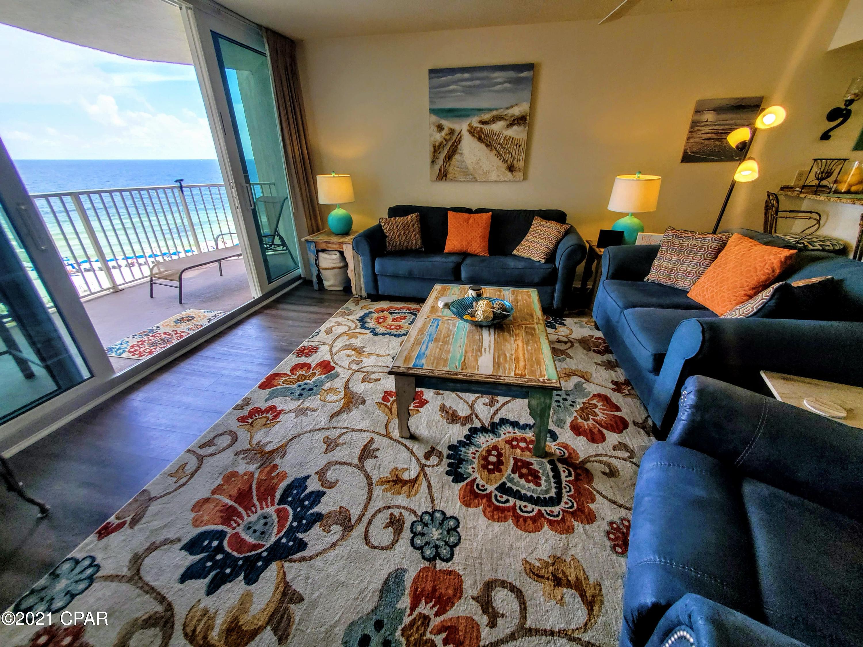 Under contract taking back ups. Rental projections of 56k yearly.  Deluxe floorplan with an oversized balcony and great gulf views!  This condo offers views from living room, kitchen and master bedroom. As well as a beautifully updated kitchen. Tile and luxury vinyl plank flooring throughout. The brand new sliding doors and windows were just installed last year adding a tremendous value to the new buyers. Sought after Dunes of Panama Resort has 1500 linear feet of sugar white sand and is a low density complex. The Dunes of Panama also has 3 pools, tennis courts, basketball court, fitness room, shuffle board, outdoor BBQ grills, poolside tiki bar & deli, souvenir shop, chair and beach rental services, and much more.