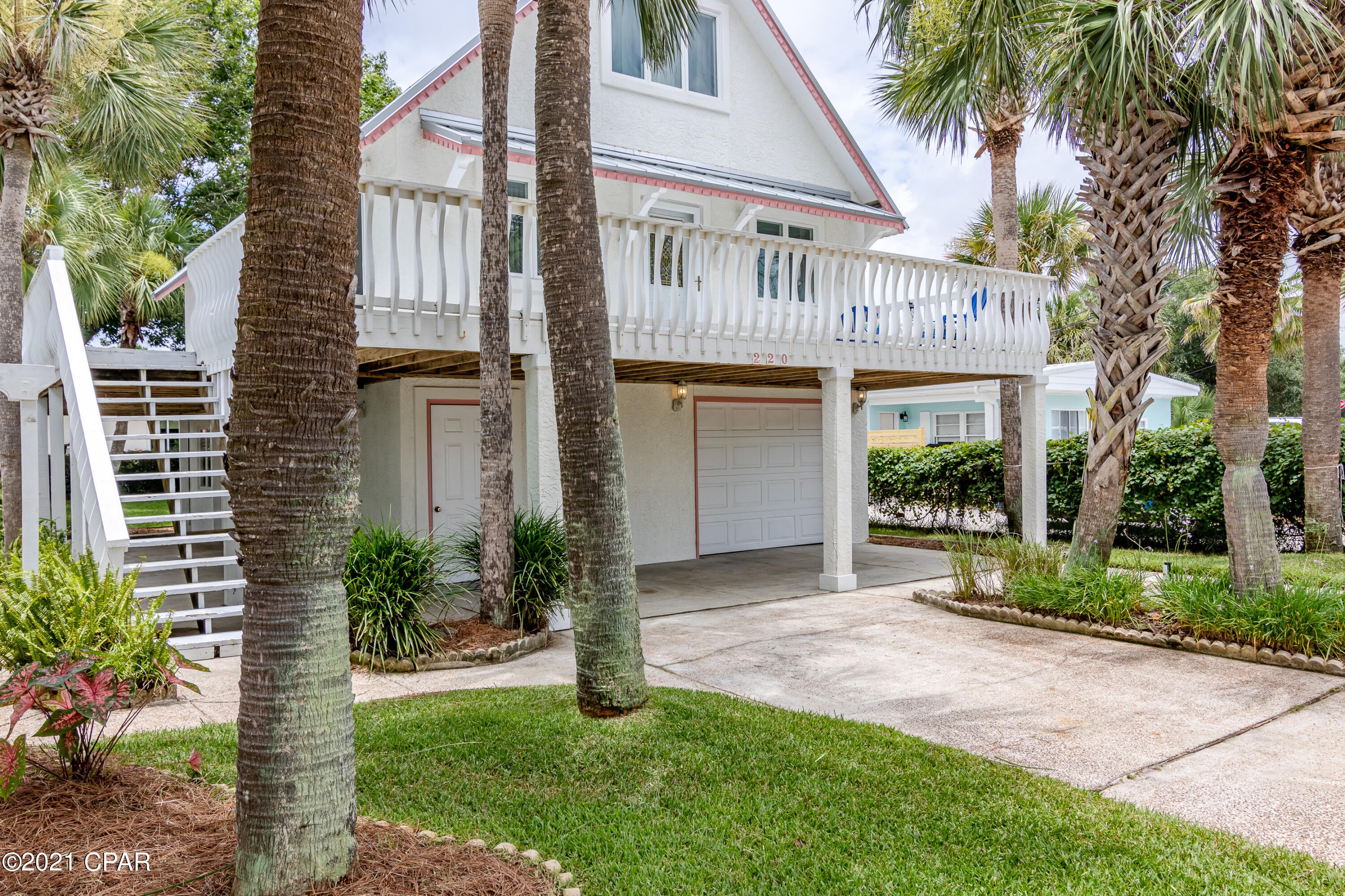 PRICE IMPROVEMENT! Epic Location and 

Epic Investment Property! Short Term Rentals allowed! With just a short 750 foot walk to white sandy beaches of the Emerald Coast (Splash Beach Access 74), makes for perfect beach living. Whether Full Time or just enjoying a great 2nd Home/Vacation Rental with Incredible Income Potential! 4 bedroom, 3 bath home has many options of living. The bottom level features 20x20 tile floors, kitchen, living room, bedroom and en-suite with inside access stairway to middle level. The main floor has laminate flooring w/ an open floor plan.  Includes a full kitchen, laundry room w/washer & dryer that convey, living/dining area, master bedroom and full bathroom.  The 3rd level has two bedrooms, reading nook, 3/4 bath and  back deck. Enjoy relaxing in the sun and fresh gulf breezes on the Huge 10x67 front deck that wraps around to the south side of the house. This amazing yard, has a gorgeous lawn with several palm trees,  mature landscaping, large raised shed matching the home, and possibly large enough lot to accommodate a pool! There is a separate irrigation well for outside sprinkler system for front and back yards and home is connected to city sewer & water. There was a camera sewer inspection to the street, completed in November 2020!  
Both kitchens include refrigerators; downstairs offers electric cook top and hood. Middle level kitchen is a full service.