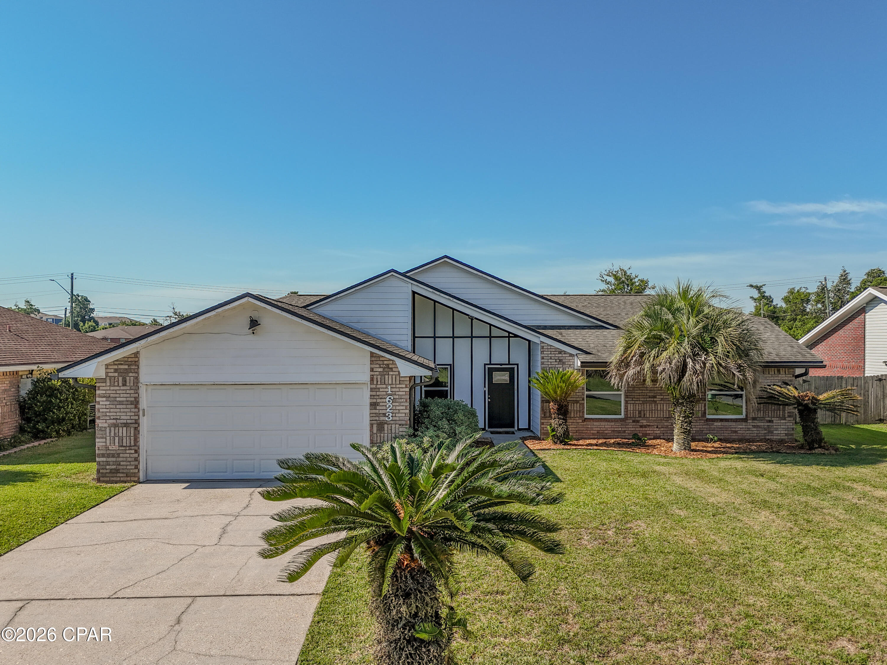 Back on the market, no fault of seller. Welcome to1623 Santa Anita Drive, Lynn Haven, FL. This 4 bedroom/2 Bath pool home offers the perfect combination of modern updates, functional living space, and resort-style outdoor living in one of Lynn Haven's most desirable established neighborhoods. This beautifully maintained Florida contemporary home features striking architectural lines, vaulted ceilings, abundant natural light, and exceptional curb appeal with mature palm landscaping and a spacious front yard.

Inside, the thoughtfully designed floor plan offers comfortable living spaces ideal for both everyday living and entertaining. The spacious kitchen serves as the heart of the home and includes a center kitchen island that conveys with the property, providing additional prep space, storage, and gathering space for family and guests. A dedicated coffee bar also conveys, creating the perfect setup for morning routines or entertaining. The laundry room includes an additional storage cabinet that will remain with the home, adding convenience and organization.

The open-concept living areas flow seamlessly while large windows and vaulted ceilings create a bright, airy atmosphere throughout the home. The layout offers the perfect blend of comfort, style, and functionality for families, entertaining, or relaxing at home.

Step outside into your own private backyard oasis featuring a beautiful in-ground pool, expansive fenced backyard, and plenty of room for entertaining, pets, play, or simply enjoying the Florida sunshine. Whether hosting weekend gatherings or unwinding after a long day, this outdoor space delivers the ideal Florida lifestyle.

Located in the heart of Lynn Haven, this move-in-ready pool home offers convenient access to top-rated schools, parks, shopping, dining, boat ramps, and nearby Panama City and Panama City Beach attractions. If you've been searching for a Lynn Haven FL home with a pool, large fenced backyard, vaulted ceilings, and updated contemporary style, 1623 Santa Anita Drive is a must-see.