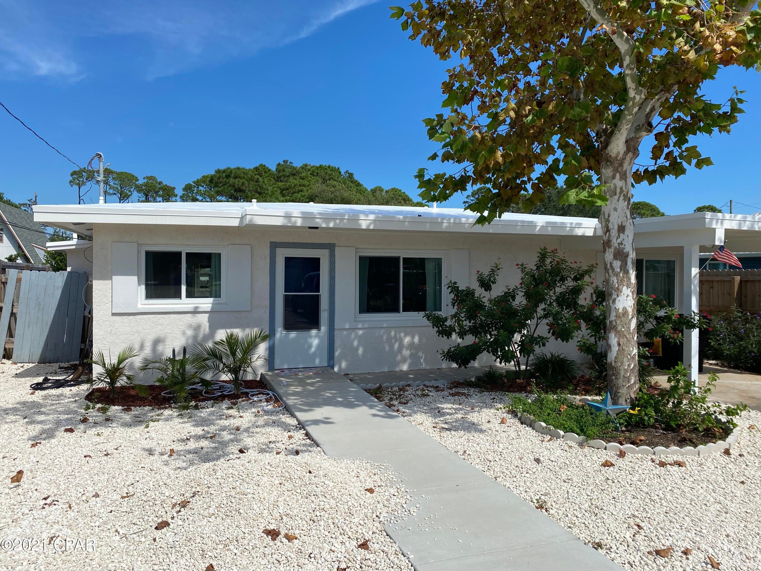 NEW NEW NEWER- This house has been taken down to Slab and Block Walls and rebuilt ground up over the last year. Started Oct 2020 and just finishing up now.  This cute little cottage is just a short walk to a dedicated beach access. Just completed a brand new Duro-Last Commercial grade Roof.  The remodel includes: All new Electrical panel, wiring and electrical fixtures (All LED LIGHTING),Plumbing fixtures including Tankless Electric Water heater, Tub/Shower, LVP flooring, New cabinets with Sea Glass Quartz counter tops, SS Samsung appliances, New Wind rated windows, Front and Back Door. Luxury Vinyl Plank flooring through out.  The Master bedroom has a very large Closet.. The Gazebo roof was replaced and completely wired with electrical for lighting and outdoor fans. New sidewalk and driveway poured for additional quest parking. I park my 42'' RV in the driveway and added 50 Amp service. To finish it all off, The entire outside of the home was just Re-Stucco'd. All exterior soffits were replaced with hardi-board. There is even a outside shower with Hot/Cold Water. Ton's of white rock laid down to minimize yard work. There are No HOA fee's and this home would be a great AirBNB or VRBO property. Our anticipated annual revenue was around $40K-$45K per year. Come completely Furnished with all new furnishings. Should be completely rental ready except for linens. AC outside unit was upgraded to 2.5 ton 6 months ago and all new interior coil in air handler with warranty. This is a gem and ready to sell.