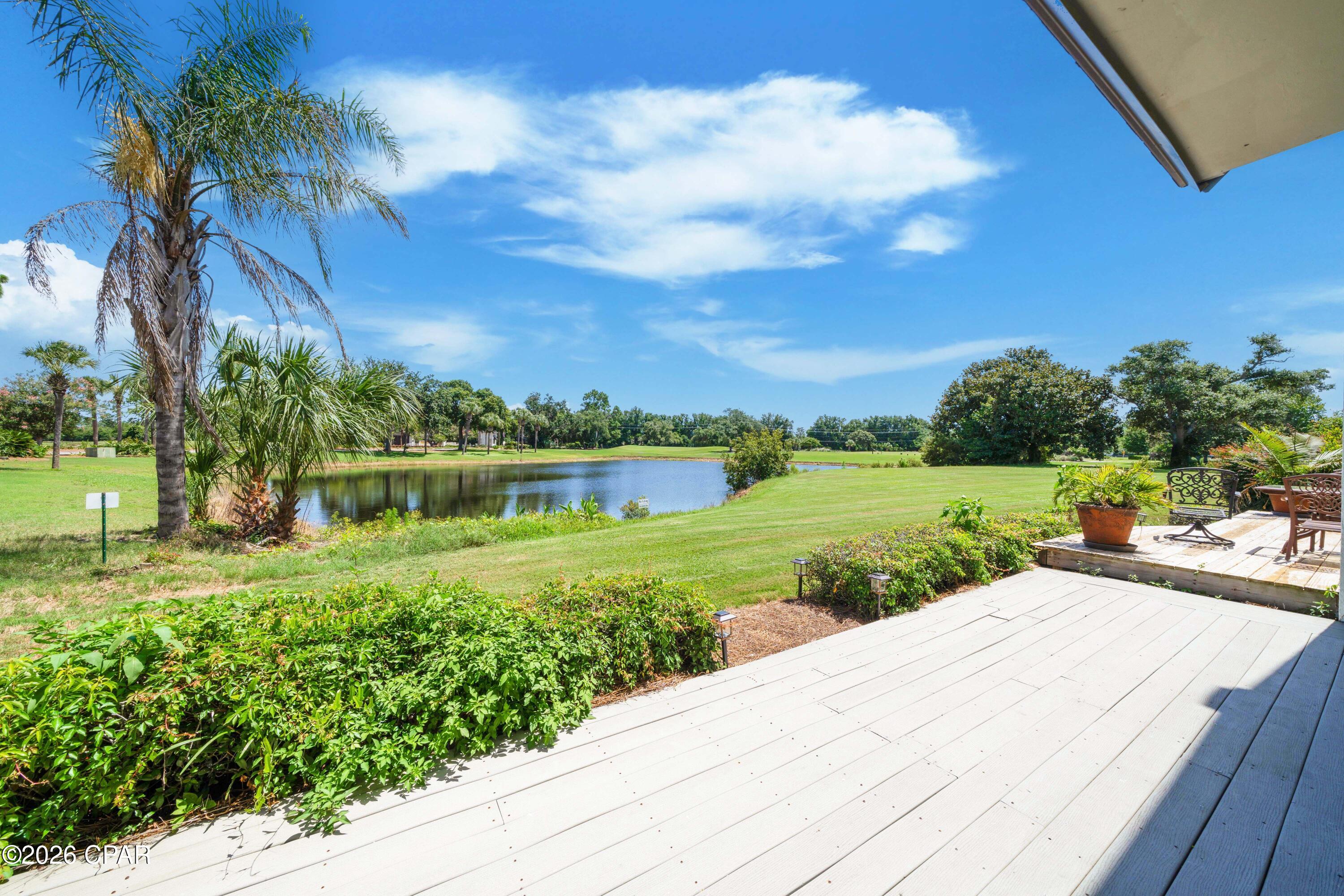 Welcome!  Come enjoy picturesque pond views overlooking the Jack Nicklaus Golf Course from this beautifully situated 3-bedroom, 2.5-bath home in the gated community of Bay Point. In addition to 3 spacious bedrooms, you'll find a versatile bonus room that can easily serve as a 4th bedroom, home office, hobby room, or extra storage. The open floor plan is perfect for everyday living and entertaining.  Enjoy an updated kitchen that opens to your dining area and a spacious living room and large sun porch, all with beautiful views and lots of light.  The sunporch is a great spot to extend relaxing and entertaining, or an inviting multi-functional space that could also serve as a light filled home office, exercise or hobby area.  This golf villa has great outdoor spaces with pond and golf course views, including covered balconies off of two bedrooms, a large back deck, and also features a large front courtyard entry. The covered balconies and spacious back deck are the perfect places to sip a beverage, share a meal, or lounge with a book while taking in your tranquil setting.  The welcoming courtyard entrance is a large space to make your own and also features additional storage closet.  This turnkey golf villa is offered fully furnished and move-in ready for you - even the bikes stay!  Bay Point is one of the area's premier gated communities, featuring 24-hour security, a championship Jack Nicklaus golf course, a full-service marina, on-site dining, and a variety of amenities, all just minutes from the beaches, shopping, and restaurants of Panama City Beach.  Call today and make this your new home at the beach!