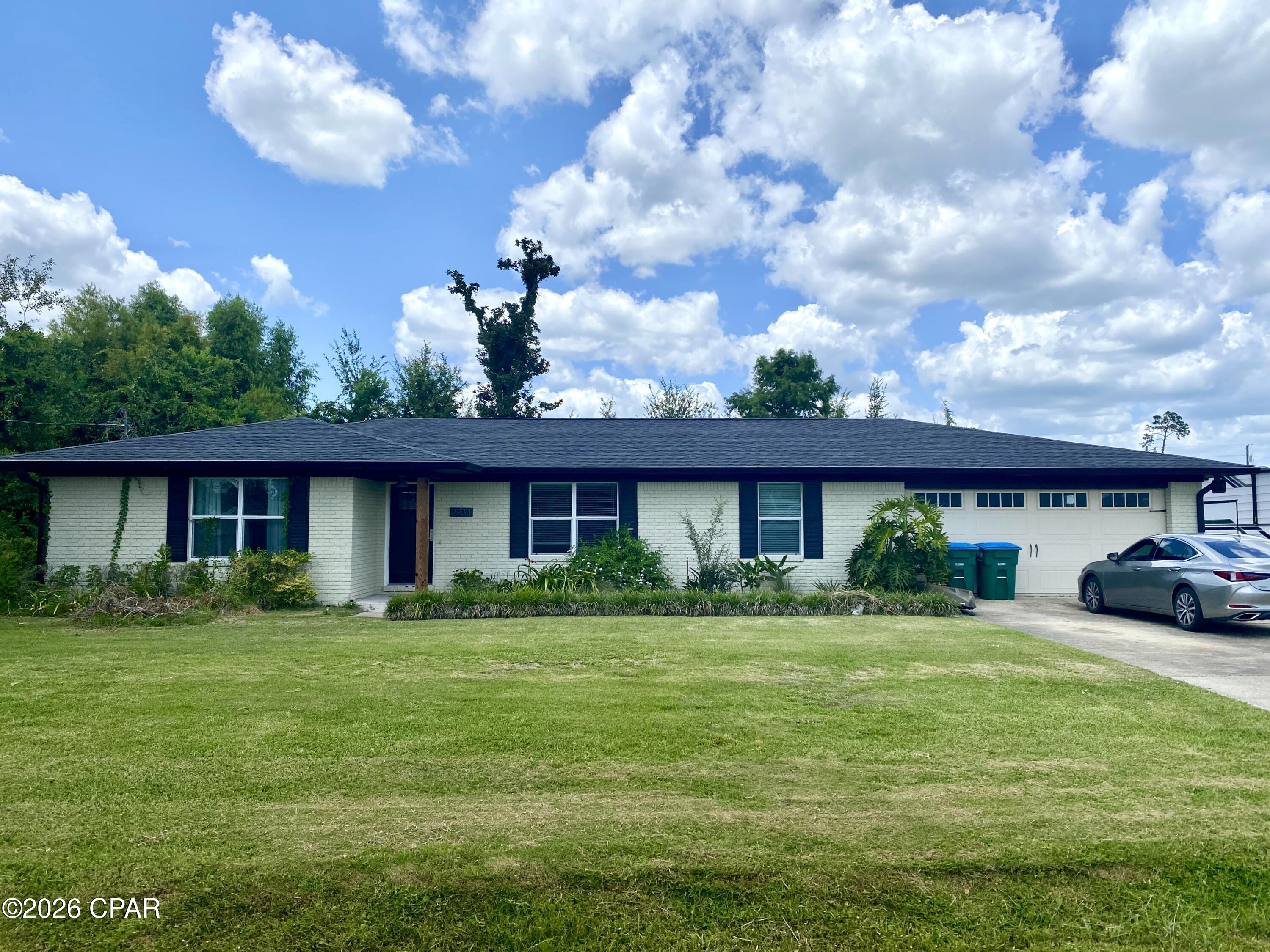 PRICE IMPROVEMENT! Lovely 3 bedroom, 2 bath home with an office, located in the highly desirable College Point subdivision in Lynn Haven. Just two streets up from the waterfront neighborhood park on North Bay. You can enjoy easy access to a picnic area, a playground, fishing and kayaking, and stunning views of the sunset over the water. This home has been previously renovated in recent years with a more modern, open-concept design to open up the family room, kitchen and dining room. Plenty of updates throughout the home to include painted cabinets, white marble countertops, stainless appliances, vinyl plank flooring, upgraded trim work to include some crown molding, decorative columns, as well as updated lighting and plumbing fixtures throughout the home. This home also offers a sunroom just off of the open living are with a covered back porch, a nice size laundry room  and a 2 car garage. This home sits on a large 100x150 lot. Schedule a showing today! **HOMEOWNER IS WILLING TO OWNER FINANCE**