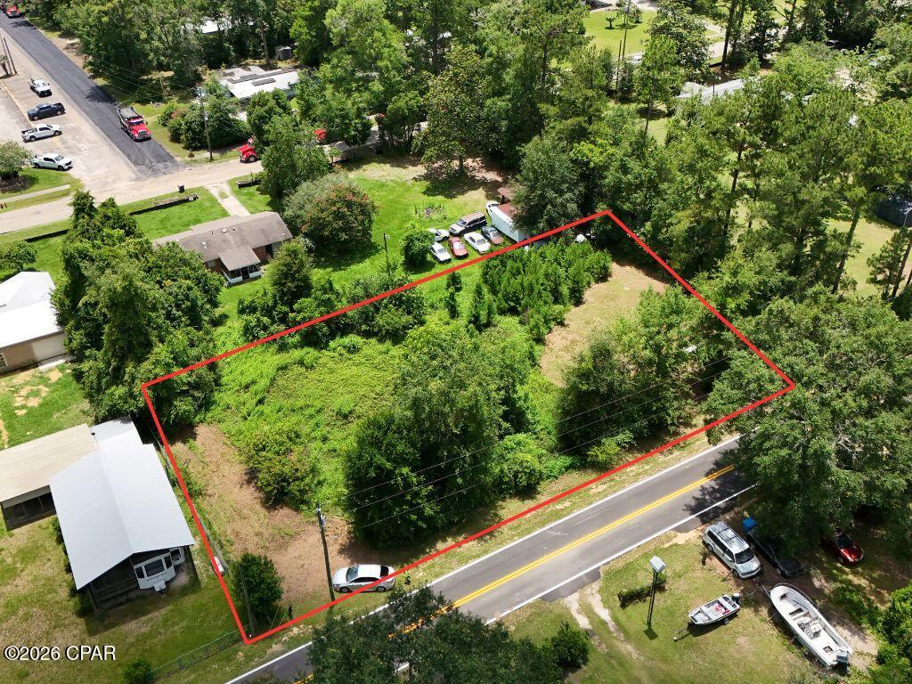 Versatile ±0.53-acre residential parcel on Henry Ave in Wewahitchka offering flexibility for a site-built or manufactured home. Available as one spacious parcel for $42,000 or potentially divided into two separate lots at $21,000 each, with a one-time subdivision allowed subject to buyer verification and approval. Zoned Residential, located in Flood Zone X, and featuring paved road frontage, city water and sewer availability along Henry Ave, and an open, flat, lightly wooded setting with no known building constraints. A manufactured home was previously located on site. Conveniently located just 0.1 miles from Wewahitchka Elementary School and minutes from outdoor recreation including fishing, boating, hunting, the Dead Lakes, and the Apalachicola National Forest region. Enjoy small-town living approximately 30 minutes from Port St. Joe and the Gulf Coast beaches.