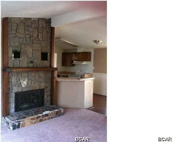 This 3 bedroom 2 bath doublewide mobile home features: nicely sized living room with a built in nook that would be perfect for your computer, stone fireplace, additional den area, kitchen equipped with refrigerator, stove/oven & dishwasher, plenty of cabinet space, separate dining area open to the living room, central heat & air. Master bath has a large mirrored vanity with plenty of counter space. Washer & dryer included. This home must be seen in person to appreciate. Centrally located in Lynn Haven. Some pets are negotiable with a $150.00 non-refundable animal fee per animal - No dogs. *All measurements are approximate.
