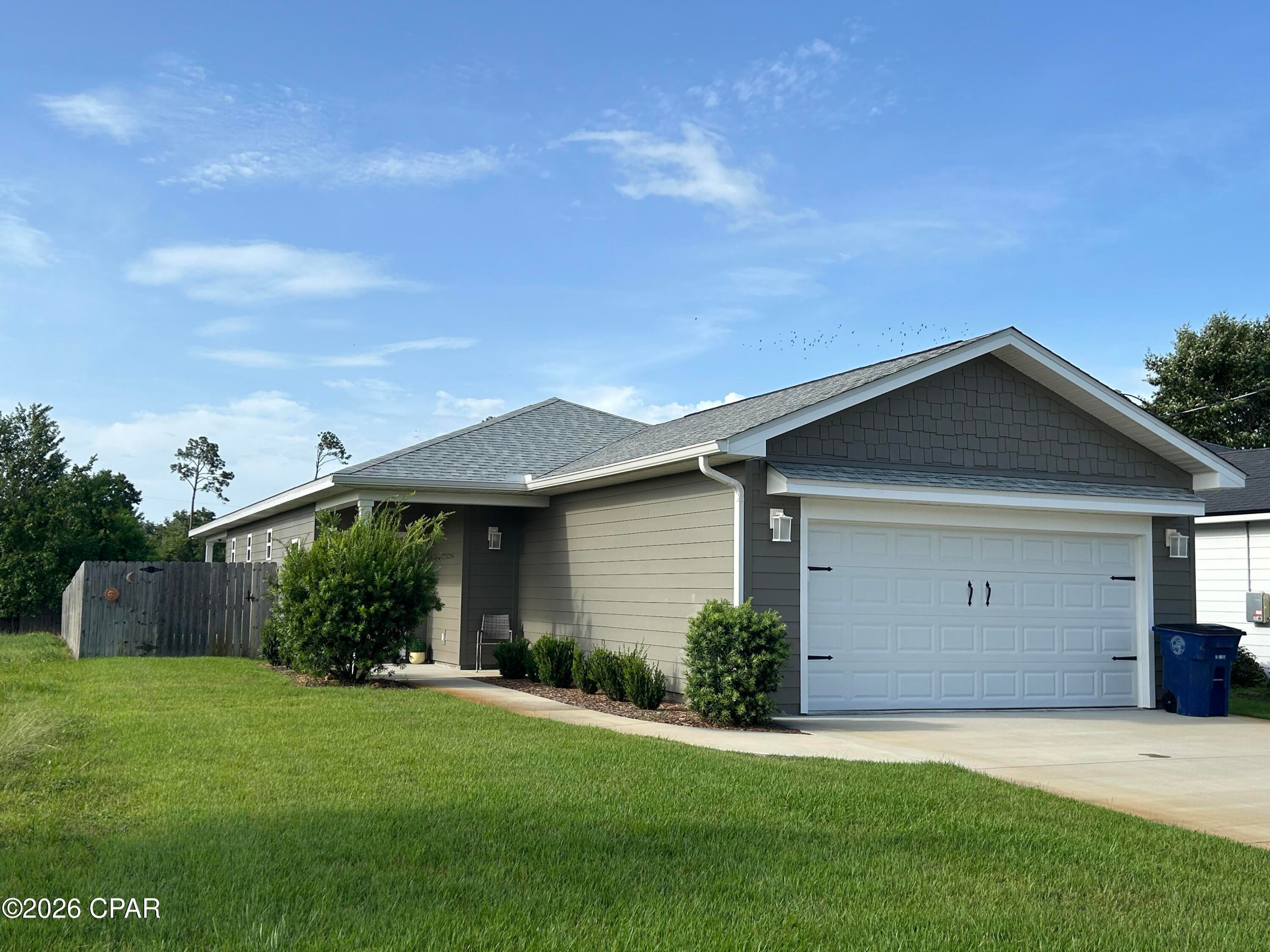 Welcome to this house located at 1210 W 10th St in Panama City, FL. This recently built home (2023) is near the Lake Caroline park area and Beach Drive. The home features a spacious layout with four bedrooms or three bedrooms and an office, and two full baths. Custom features include custom window treatments (plantation shutters, curtains and Levelor blinds), frameless shower enclosures and more. With its own well and irrigation system, keeping the grass green can't be easier! The property is conveniently located about a five minute drive from downtown Panama City or St. Andrews.