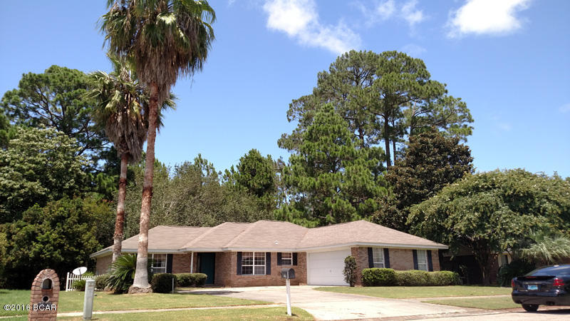 All brick 3 bedroom, 2 bath home close to Tyndall AFB. This well-maintained home with split bedroom floorplan boasts a master suite with walk in closet and ensuite bathroom with jetted tub. Great for entertaining, the updated kitchen is open to the dining area and has an island with breakfast bar. Large living area has wood floors and french doors that open to a large Florida room that can be cooled with separate air. Home also features side-entry two-car garage and a fenced back yard. Front loading washer and dryer are included. Dogs are allowed with approval and non-refundable pet fee.