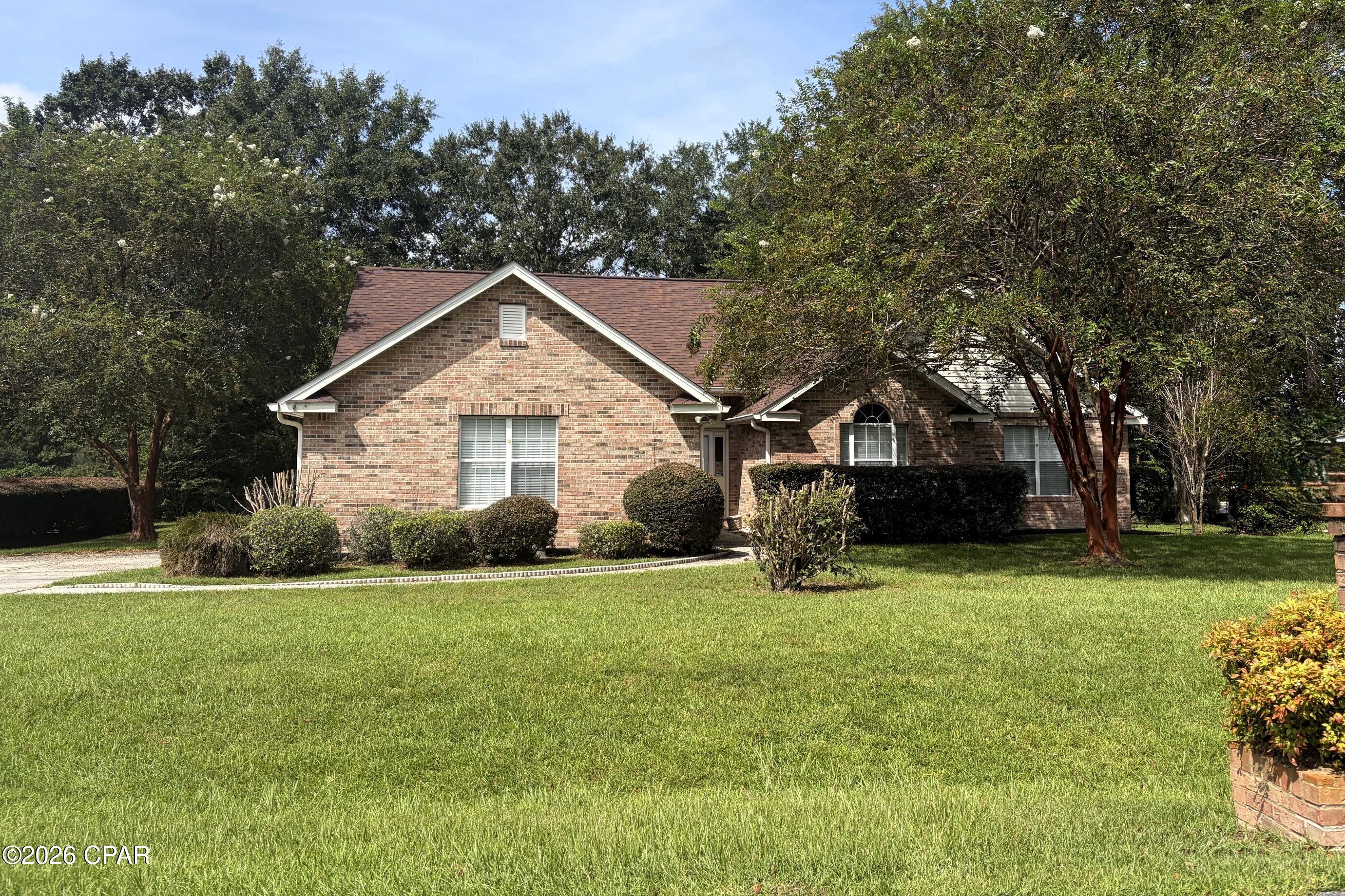 GOLF COURSE LIVING AT ITS BEST! Beautiful brick 3-bedroom, 2-bath home situated directly on the golf course in desirable Country Club Estates II. Set on approximately half an acre beneath a canopy of mature trees, this well-maintained home offers 2,077 square feet of heated living space and a peaceful setting with beautiful views.

Step inside to a welcoming foyer with soaring vaulted ceilings and beautiful hardwood floors that continue through the main living areas. The spacious floor plan features a remarkably large primary suite with its own comfortable sitting area--a wonderful retreat with plenty of room to relax, read, or create a private sitting space.

The bright enclosed sunroom provides an inviting extension of the living space and opens onto an additional patio accessible from both the living room and sunroom. Together, these spaces create a wonderful setting for morning coffee, relaxing afternoons, or entertaining while enjoying the golf-course surroundings.

Additional features include three spacious bedrooms, two full baths, a two-car garage, mature landscaping, and an architectural shingle roof installed in 2019. French doors and abundant windows bring natural light into the home while taking advantage of the beautiful outdoor setting.

Conveniently located in Havana, just minutes from downtown and an easy drive to Tallahassee, this is the kind of property that offers the best of both worlds: a peaceful golf-course setting, generous living spaces, and the warmth and character of an established brick home.

Come see why 104 Greenway Drive is such a special place to call home!