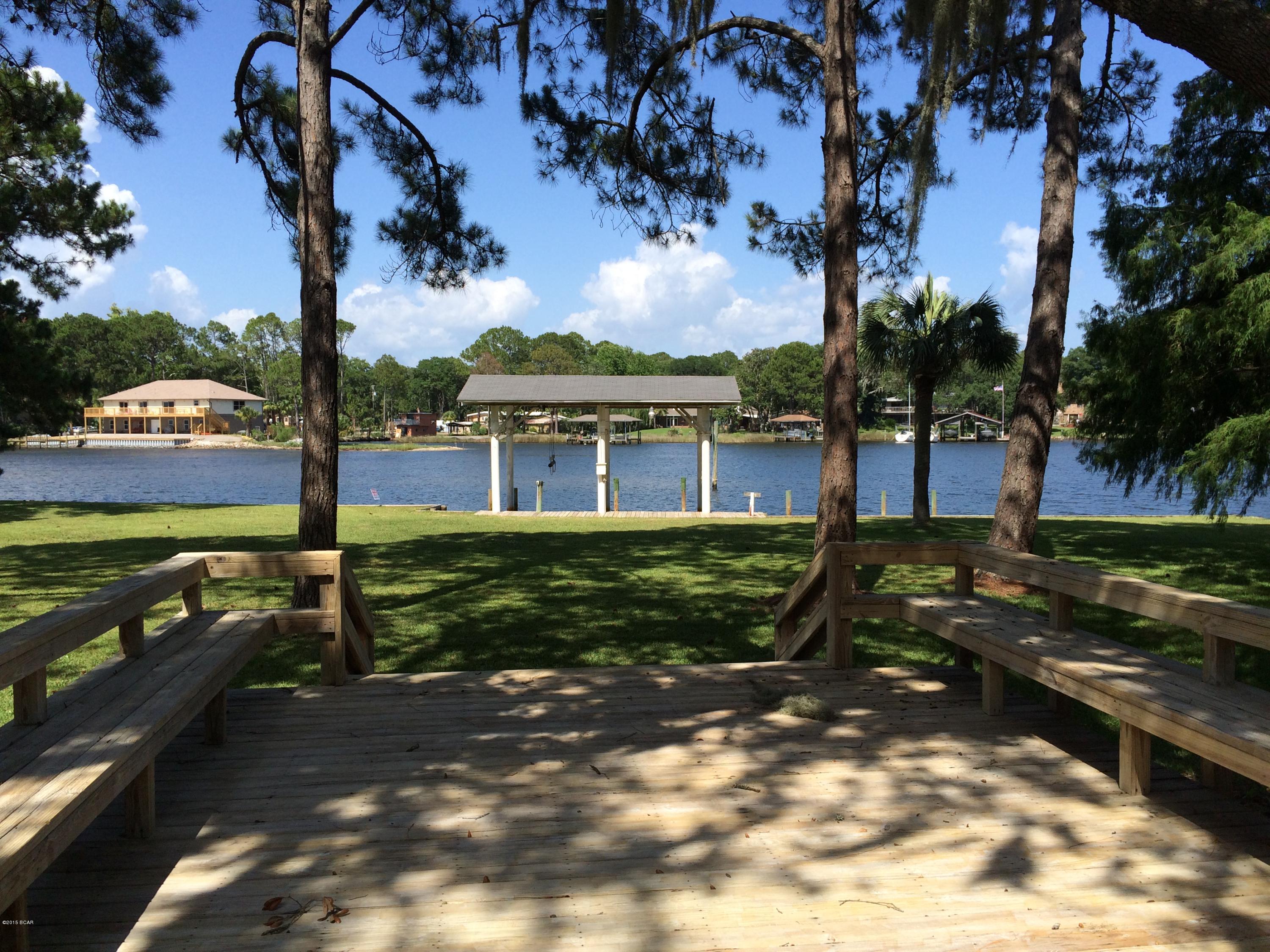 This is a great opportunity to own a waterfront home on a large lot in Panama City.  This 3 bedroom, 2 bath home has been completely renovated and has new carpet, new exterior paint, new septic system, and a new roof.  The property overlooks Posten Bayou and features a covered boat house and a new seawall with 250 feet of water frontage.  Located within very close proximity to Gulf Coast College, this home is in a great location with close access to area retail and dining. Sellers will consider a real estate exchange or some owner financing.