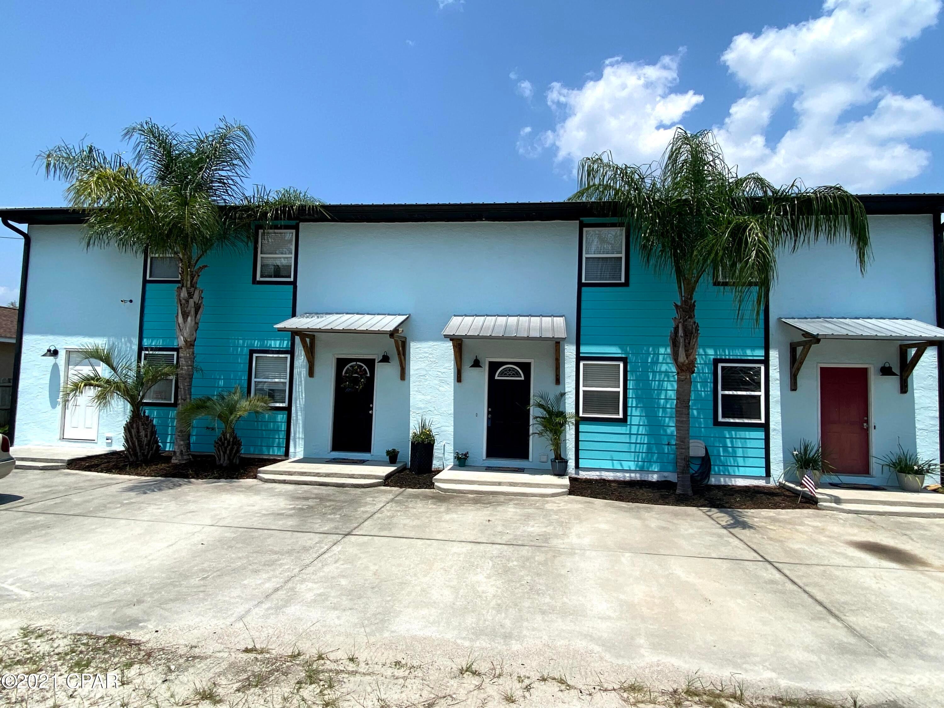 CURRENTLY UNDER CONTRACT, SELLER ACCEPTING BACKUP OFFERS - Fantastic location- This Spacious townhome is just a short walk to the Beach AND the Lagoon boat launch. No maintenance back yard and NO HOA fees. YES it can be a short term rental. The owners will include all the furnishing if you want to use as a rental or take them out. Up to you.  A cozy cabana in back with a hammock to enjoy in the lazy summer days. The Florida Room has AC and a closet so it could be and additional bedroom or a great office. The bottom flooring is all tile and a 1/2 Bath. Galley Kitchen is nicely appointed with a newer Samsung Refrig. Upstairs bedrooms are spacious and all furnishing stay. Master bedroom has His/Her closets. The exterior has been painted a nice beachy color with plenty of parking for guest.