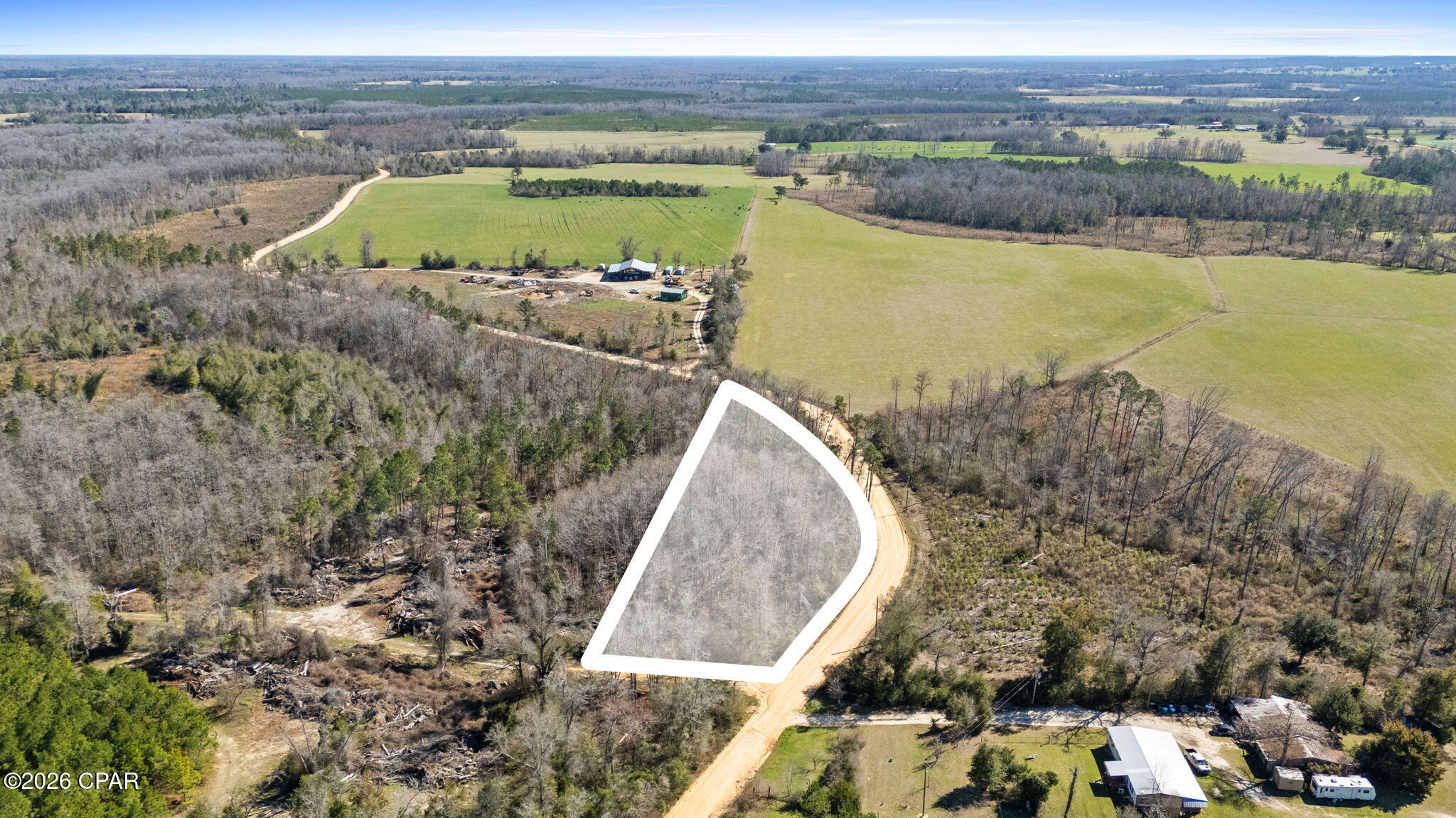 If you've been looking for room to spread out and escape the noise, this 1.5-acre parcel on Swaills Rd delivers. Surrounded by natural landscape and open countryside, the property offers a peaceful setting with plenty of space to design your future homesite, weekend retreat, or recreational getaway.

Enjoy the quiet charm of rural living while remaining within reasonable driving distance to Marianna, Chipley, and surrounding North Florida communities for shopping, dining, and everyday conveniences. The area is known for its wide-open spaces, agricultural surroundings, and relaxed lifestyle, making it an ideal opportunity for buyers seeking privacy without being completely disconnected.

Buyer to perform all due diligence regarding utilities, zoning, land use, access, and property suitability for intended use.