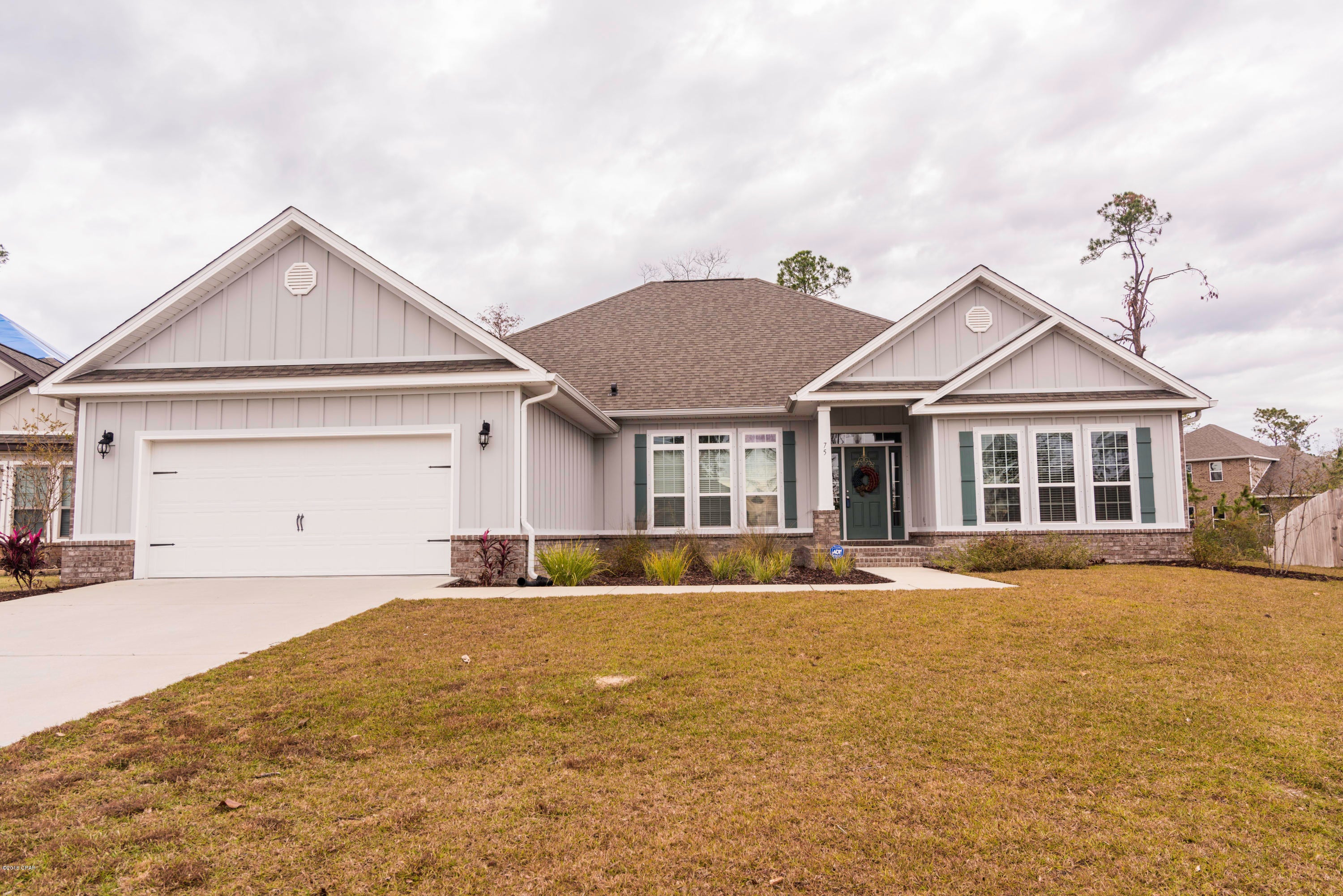 Better than new, move in ready home in Fanning Bayou! This home features many upgrades that you would not get with a new build such as custom back splash, beautiful dining room light, rounded entry ways, tile and glass master shower, hard wood flooring and sprinkler system in front and back yard.  Other features include granite counter tops, Office w/french doors,extra large master suite,huge pantry,and plenty of inside storage. Imagine sipping your coffee on your large covered patio over looking a natural preserve and no neighbors behind your home! You'll enjoy the big back yard with plenty of space for a pool. Don't want the hassle of a pool? The community has a resort style pool, hot tub, and recreation area! This community is truly Bay Counties hidden treasure.